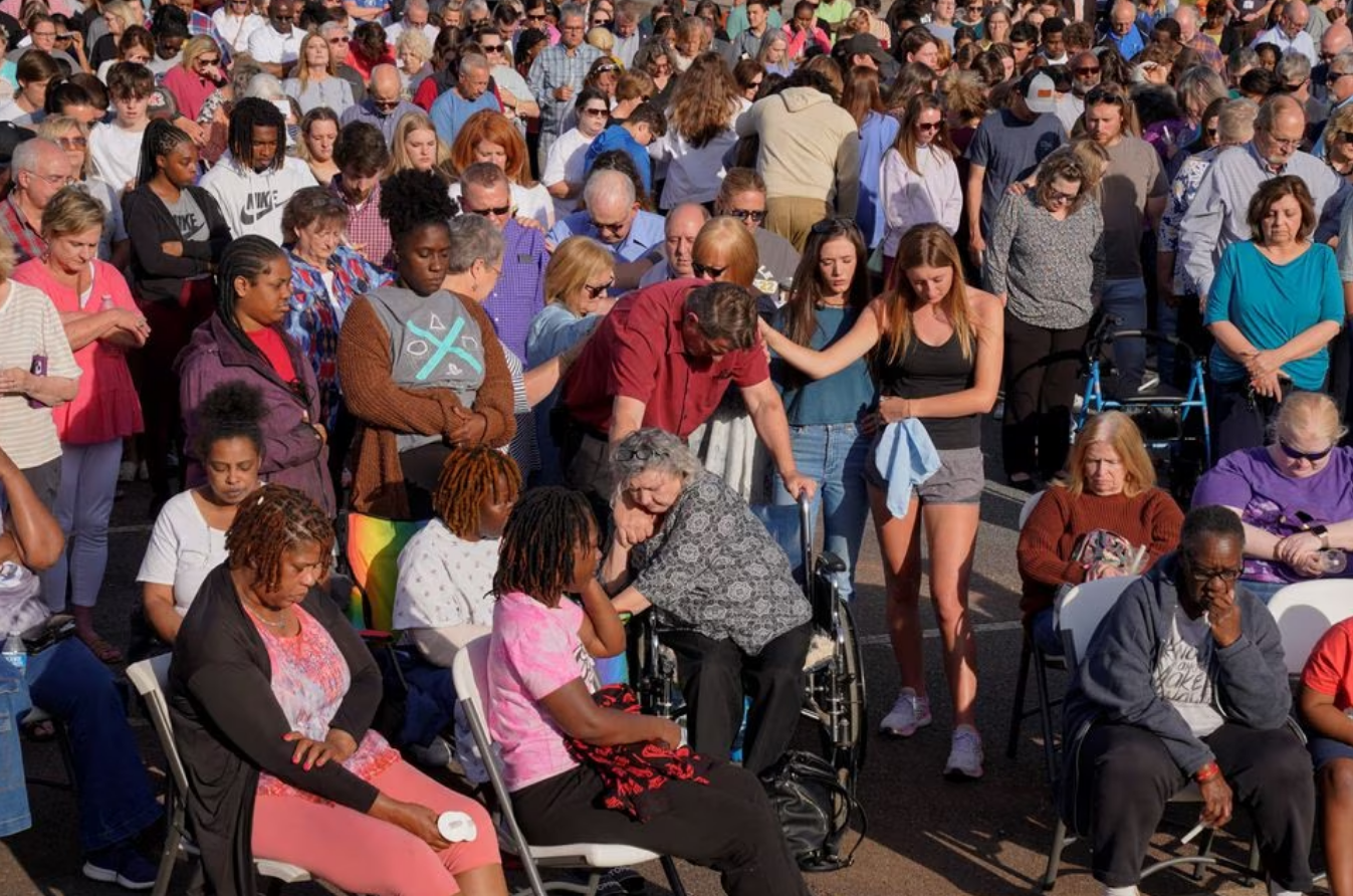 Community members embrace each other during a vigil the day after a shooting during a teenager's birthday party at Mahogany Masterpiece Dance Studio in Dadeville, Alabama, U.S., April 16, 2023. Photo: Reuters