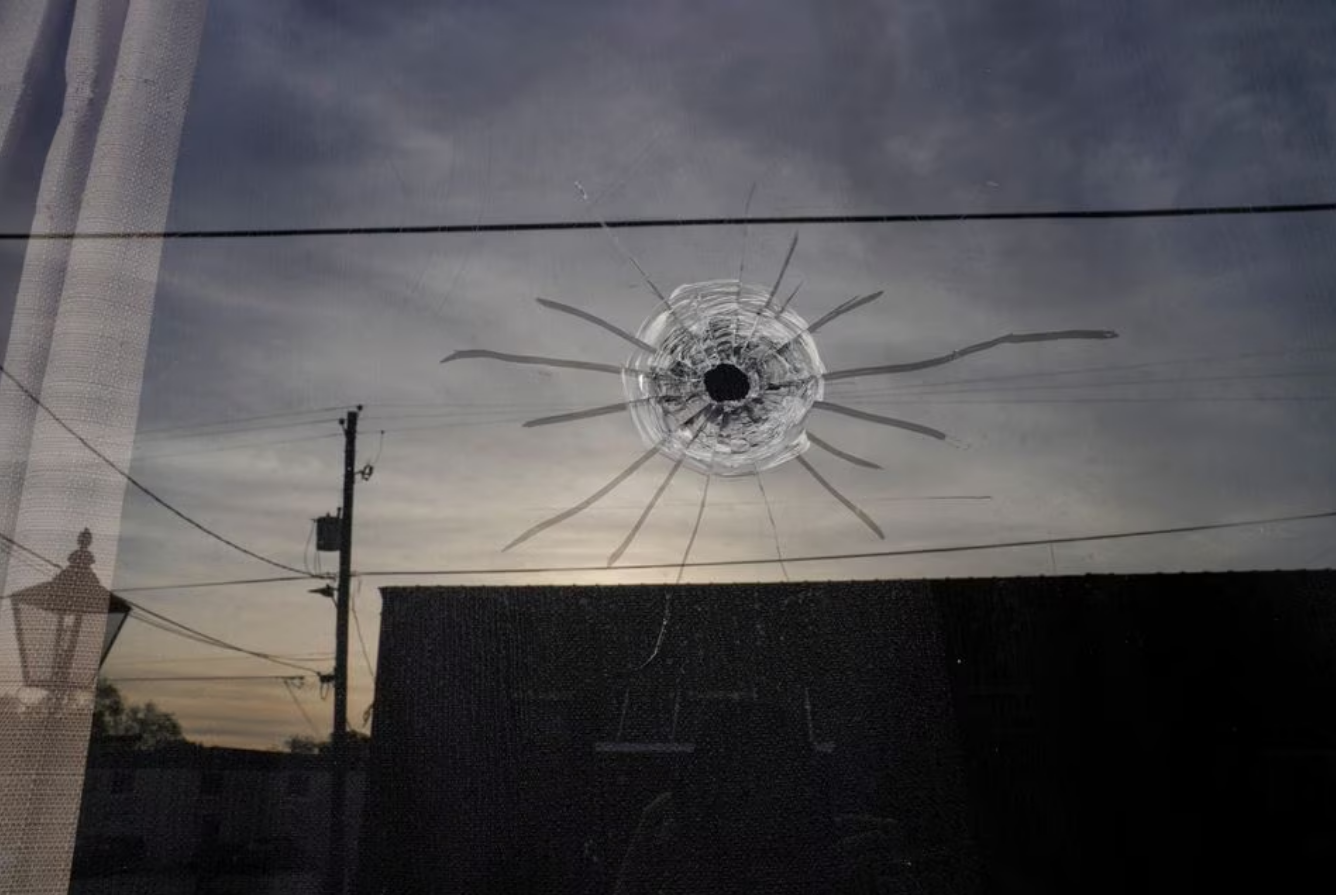 A bullet hole is seen at the entrance of Mahogany Masterpiece Dance Studio the day after a shooting at a teenager's birthday party, in Dadeville, Alabama, U.S. April 16, 2023. Photo: Reuters