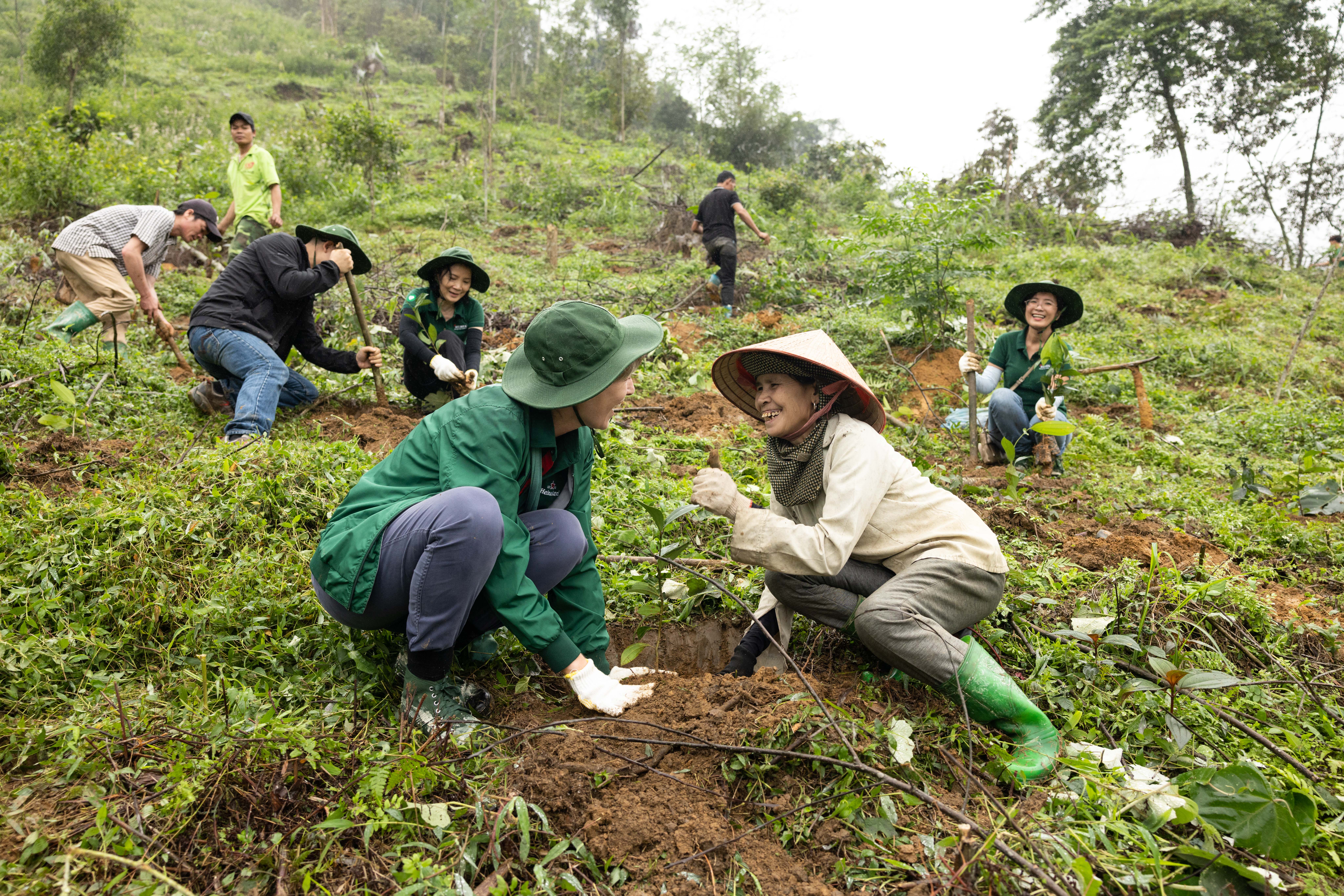 Representatives plant trees at the Xuan Son National Park in Phu Tho Province, northern Vietnam, April 14, 2023