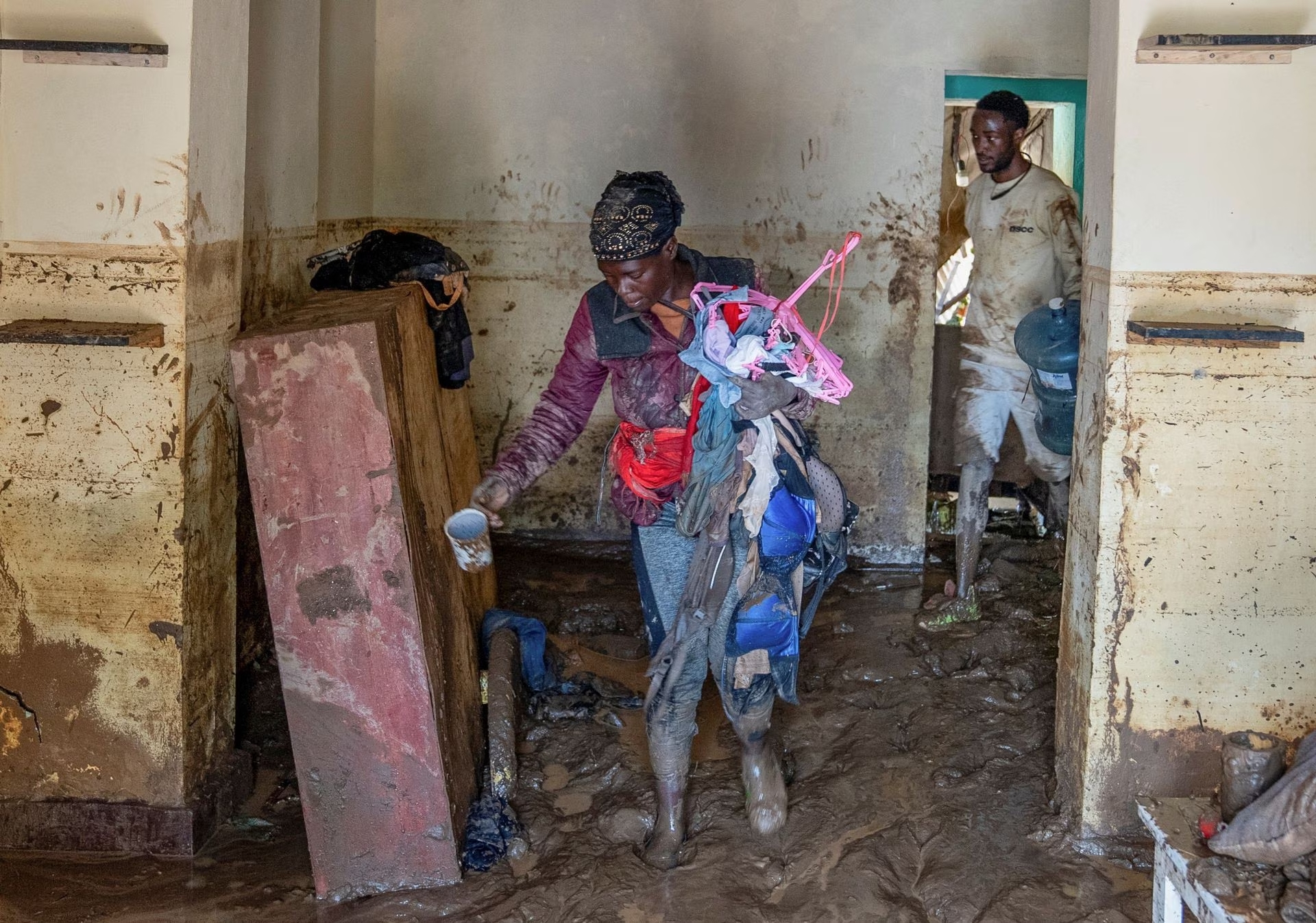 Residents salvage their household items after their home was swamped following rains that triggered flooding and landslides in Rubavu district, Western province, Rwanda May 3, 2023. Photo: Reuters