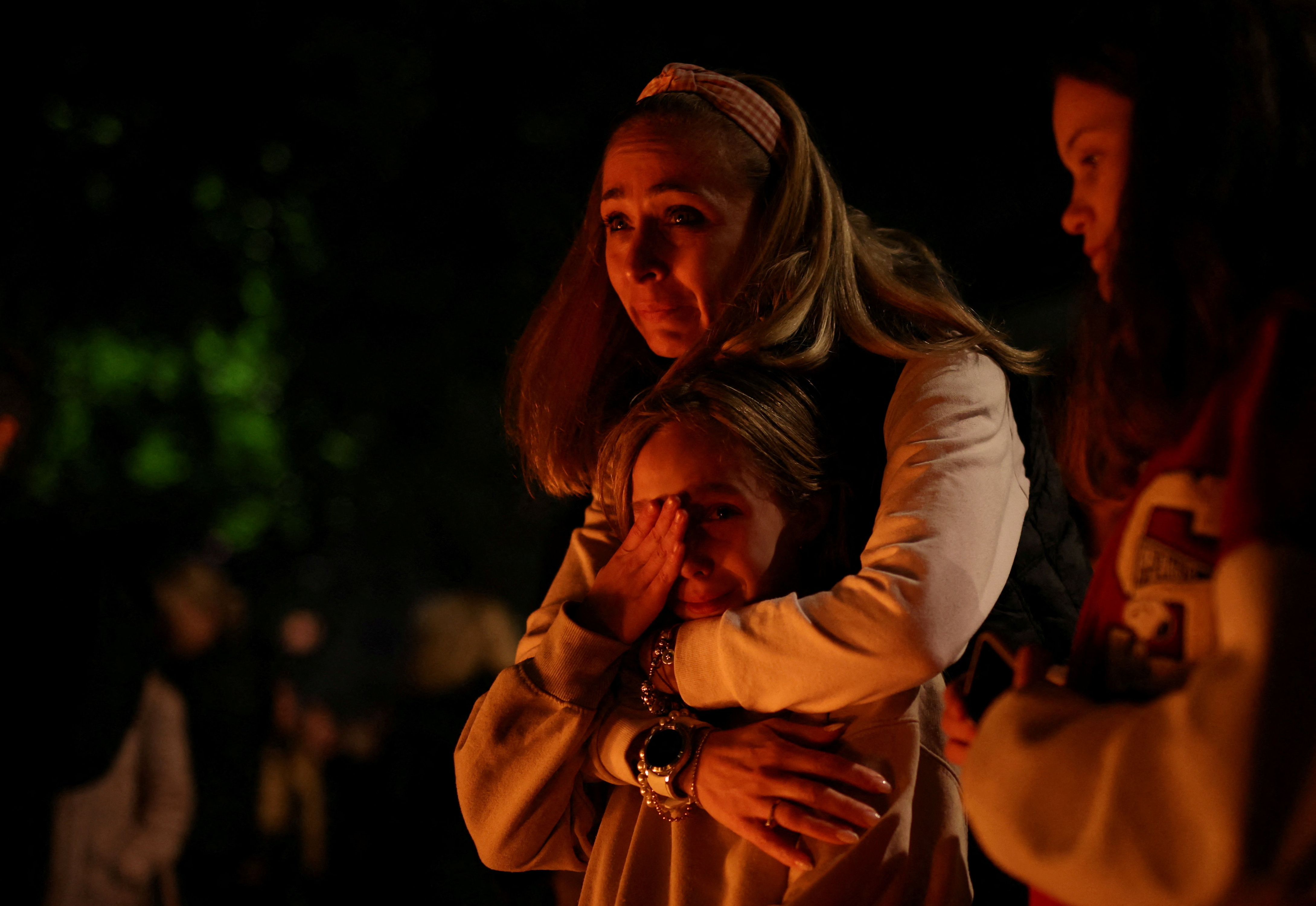 A mother and child react outside the school, in Belgrade, Serbia, May 3. Photo: Reuters