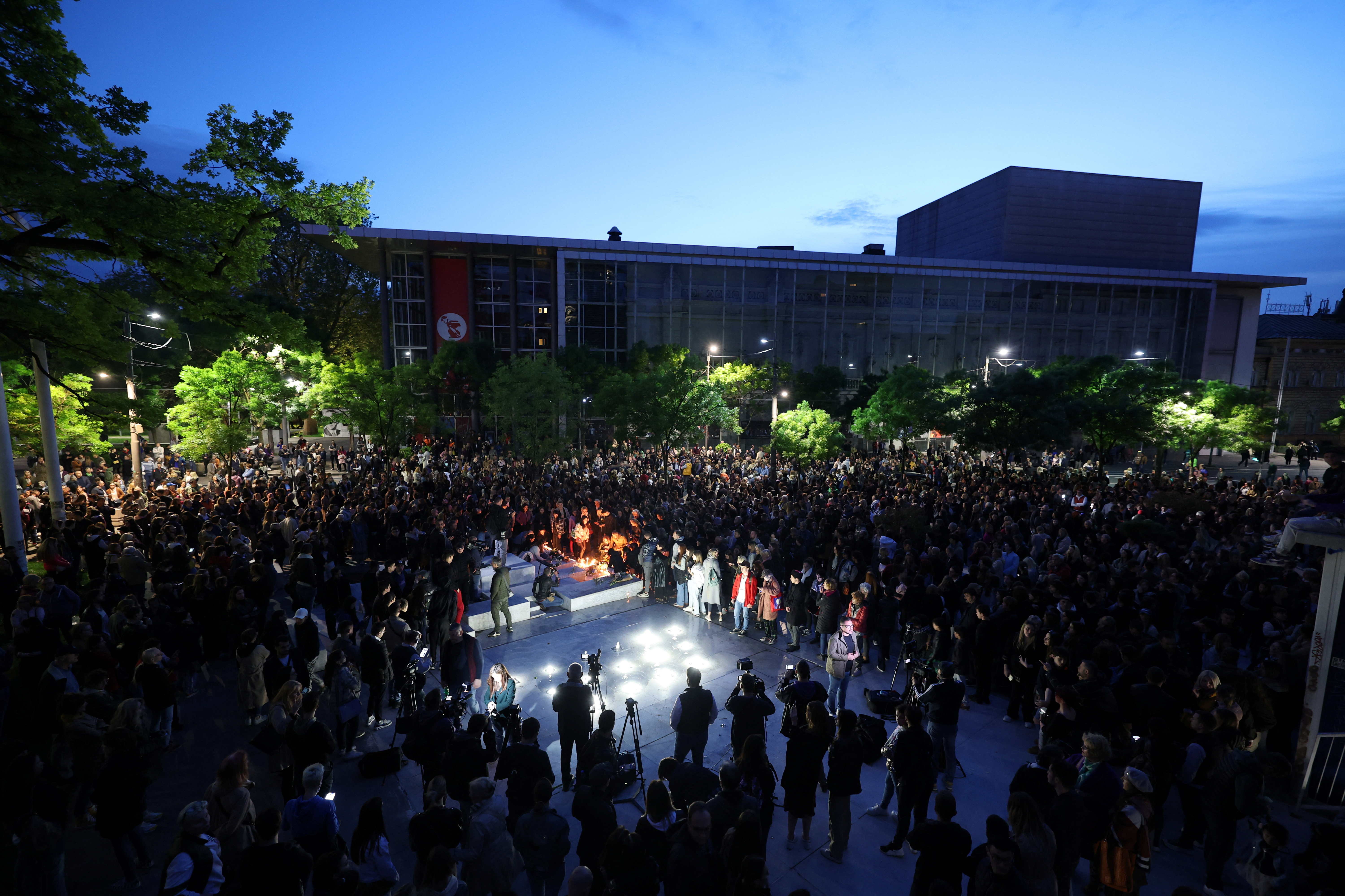 People light candles at Cvetni Trg (Flower Square), near the school after a boy opened fire on others, killing fellow students and staff in Belgrade, Serbia, May 3, 2023. Photo: Reuters