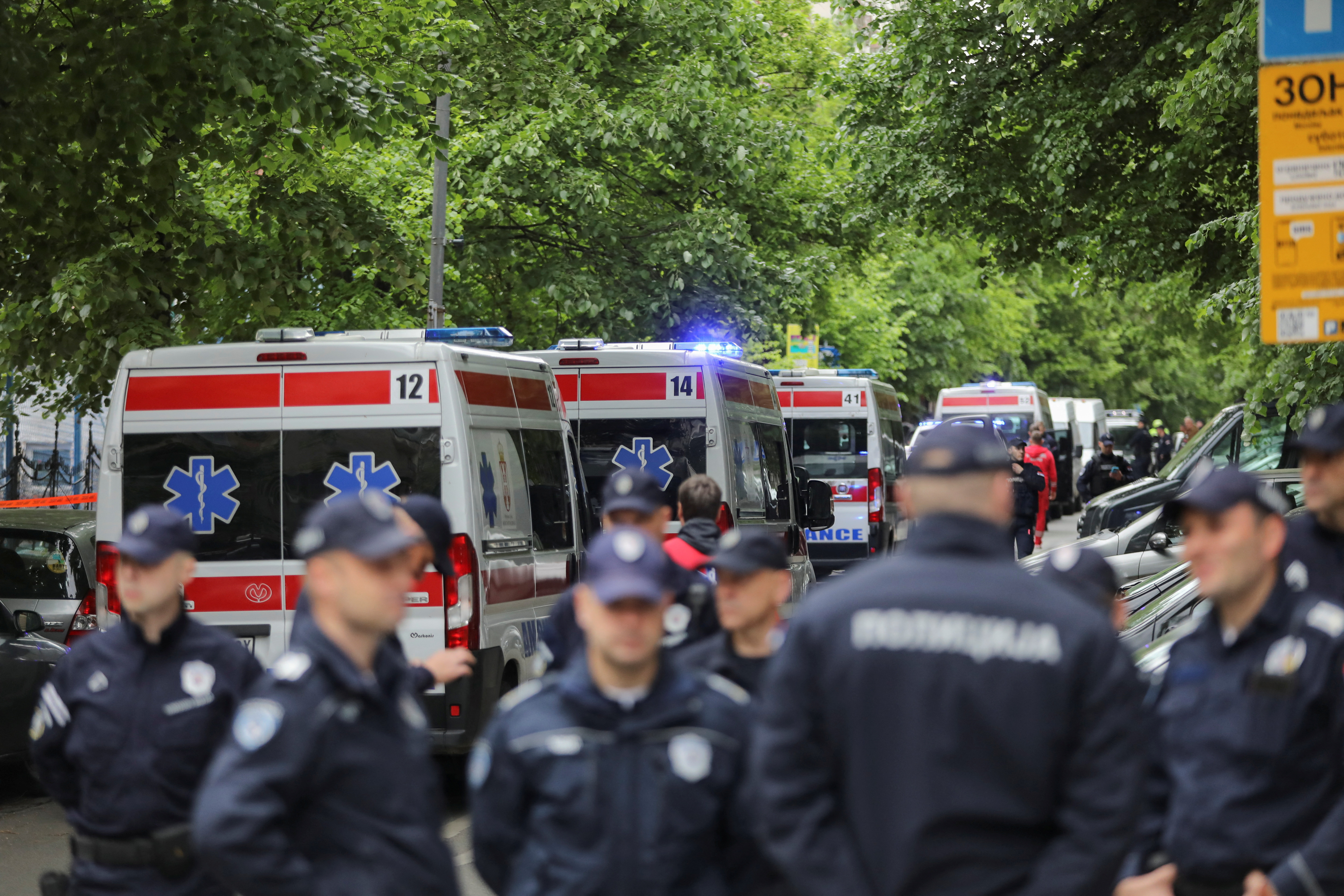 Police officers secure the area after a 14-year-old boy opened fire on other students and security guards at a school in downtown Belgrade, Serbia, May 3, 2023. Photo: Reuters