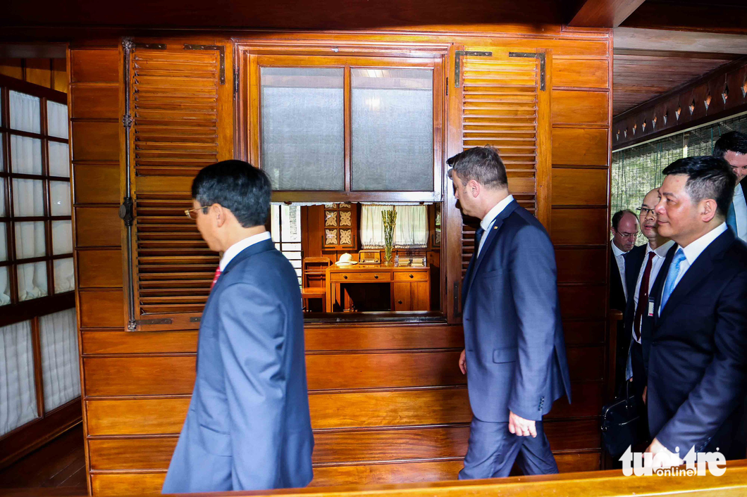 Prime Minister of Luxembourg Xavier Bettel visits the stilt house of late President Ho Chi Minh. Photo: Nguyen Khanh / Tuoi Tre