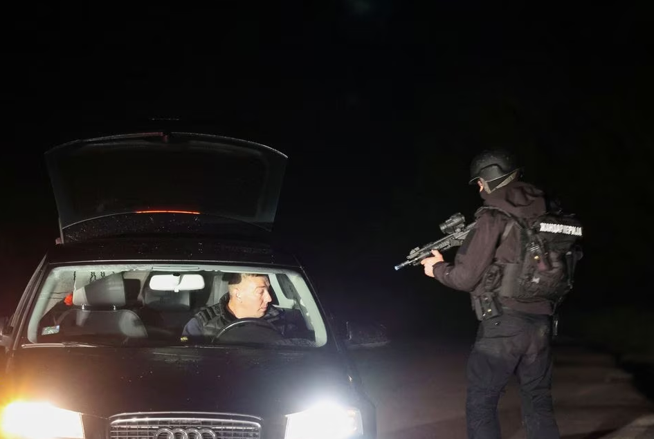 A member of security forces operates in a checkpoint during the aftermath of a shooting, in Dubona, Serbia, May 5, 2023. Photo: Reuters