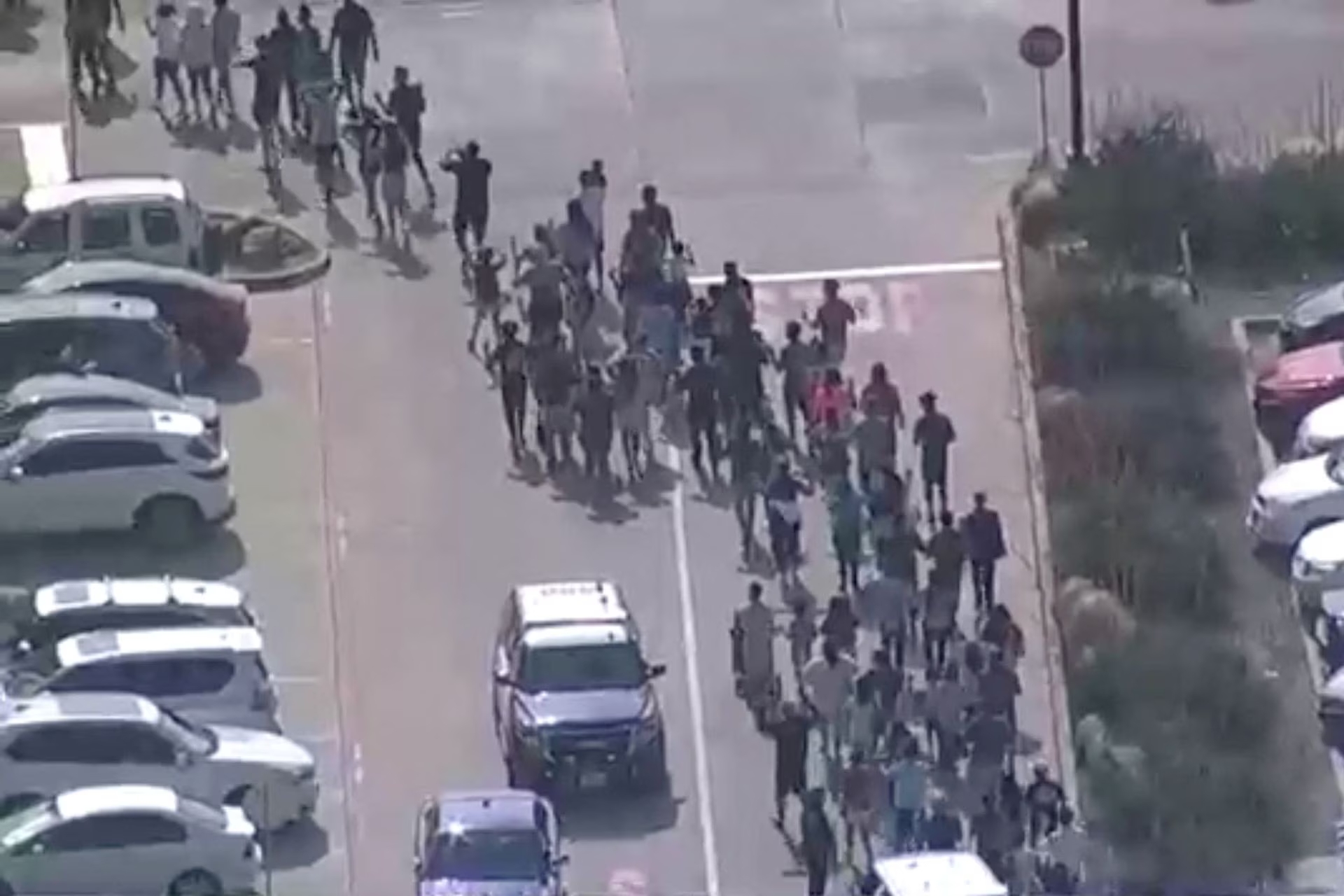 Shoppers leave as police respond to a shooting in the Dallas area's Allen Premium Outlets, which authorities said has left multiple people injured in Allen, Texas, U.S. May 6, 2023 in a still image from video. Photo: Reuters