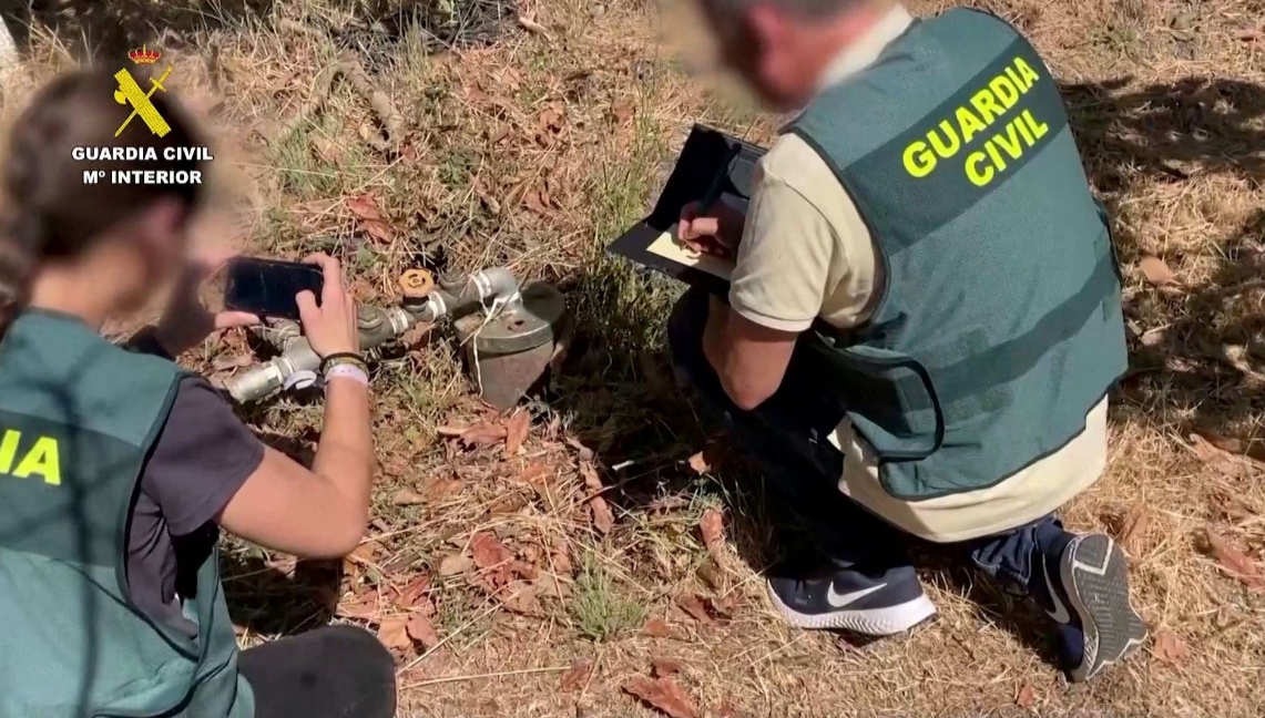 Spanish police officers document illegal water pipes in Malaga province, Spain in this screen grab from an undated handout video. Photo: Reuters
