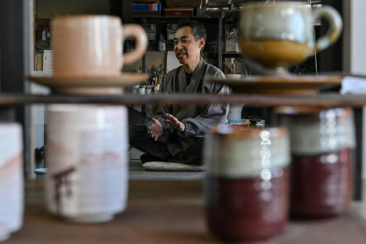 Third-generation potter Kosai Yamane uses ash from the burned cranes to glaze his ceramics. Photo: AFP