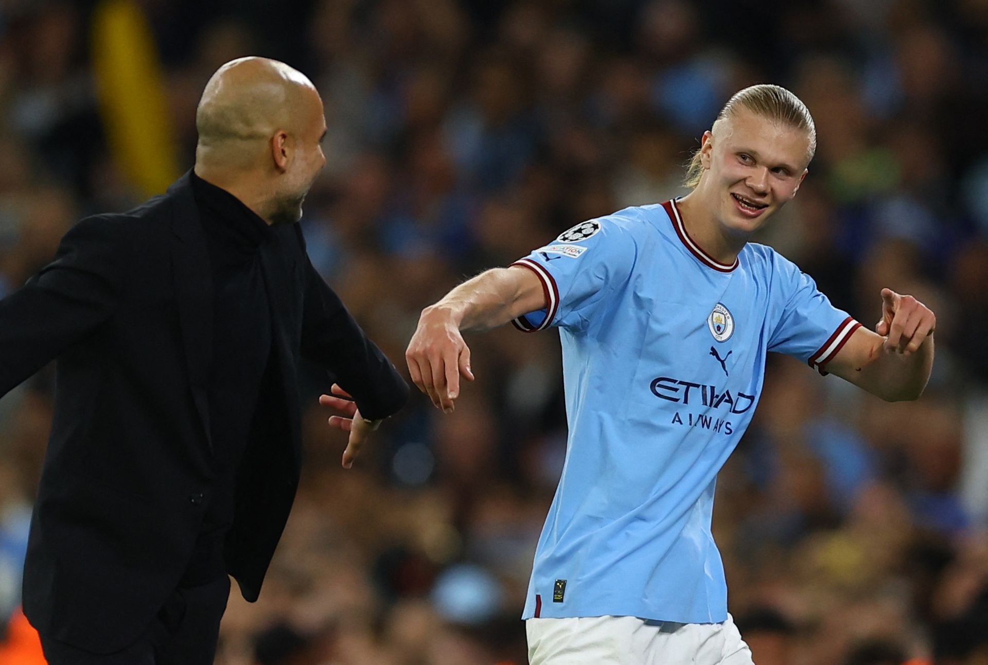 Soccer Football - Champions League - Semi Final - Second Leg - Manchester City v Real Madrid - Etihad Stadium, Manchester, Britain - May 17, 2023 Manchester City manager Pep Guardiola with Erling Braut Haaland after being substituted. Photo: Reuters