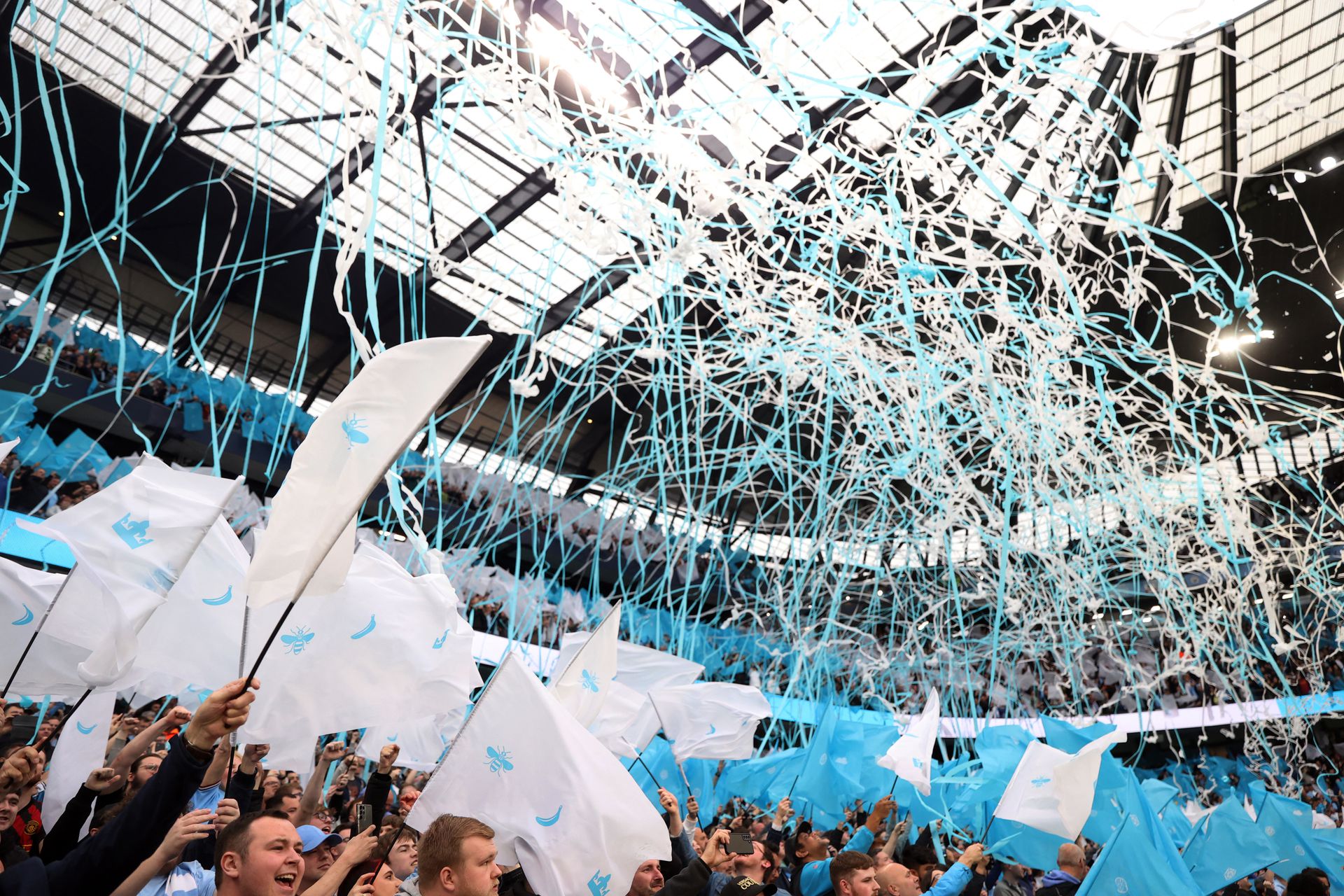 Soccer Football - Champions League - Semi Final - Second Leg - Manchester City v Real Madrid - Etihad Stadium, Manchester, Britain - May 17, 2023 Manchester City fans with flags inside the stadium before the match. Photo: Reuters
