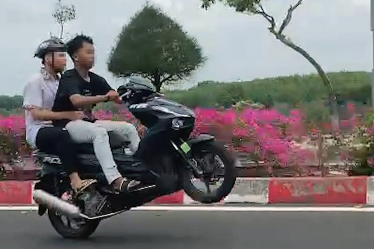 2 students in southern Vietnam booked for doing wheelie, posting clip on Internet