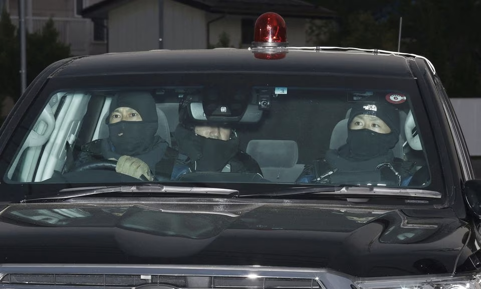 A car carrying a man who committed a shooting and stabbing incident enters the Nakano Police Station in Nakano, Nagano Prefecture, central Japan, in this photo taken by Kyodo on May 26, 2023. The man is unseen in this picture. Mandatory credit Kyodo/via Reuters