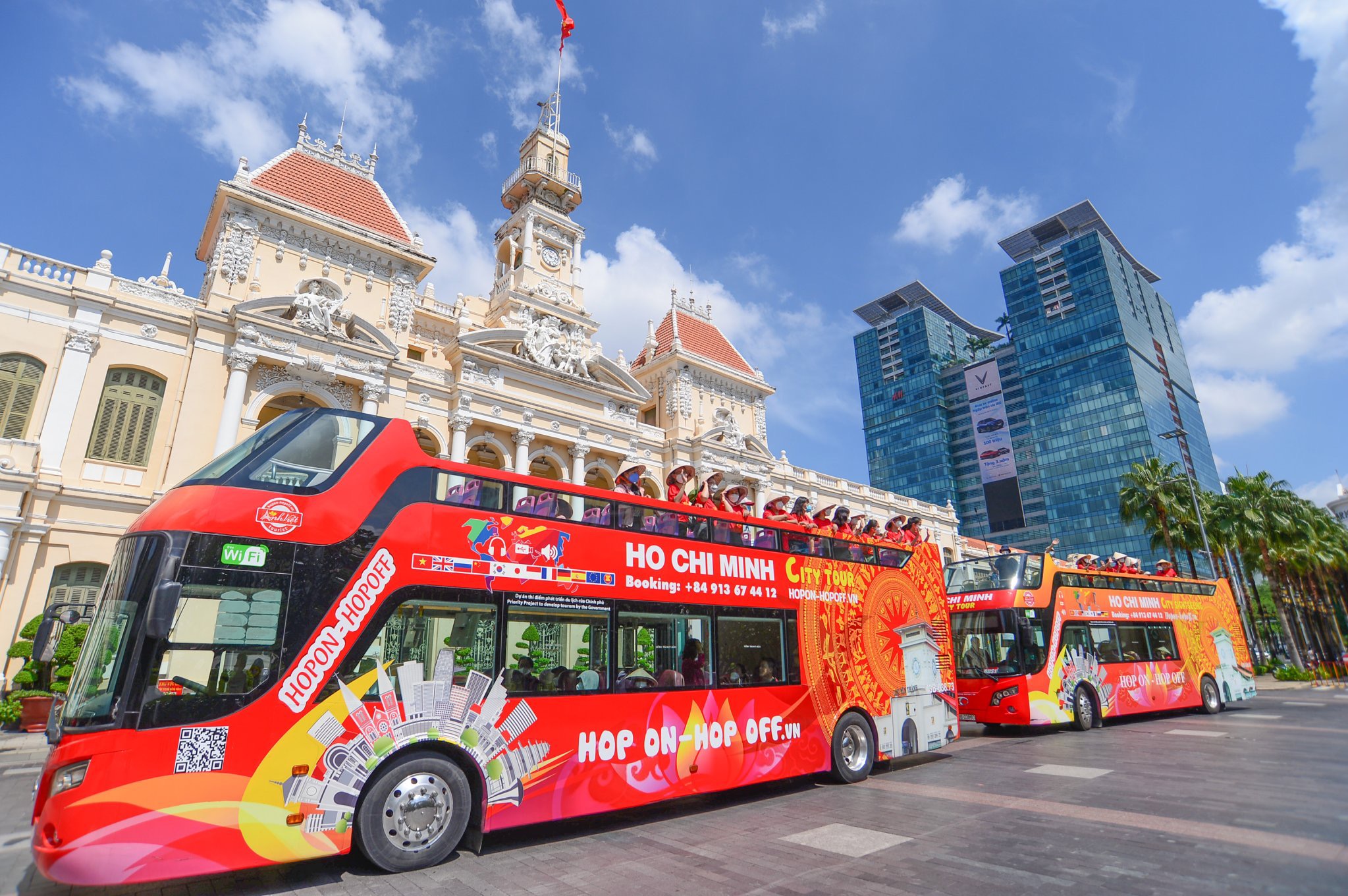 Tourists join an open-top double-decker bus tour in Ho Chi Minh City. Photo: Quang Dinh / Tuoi Tre News