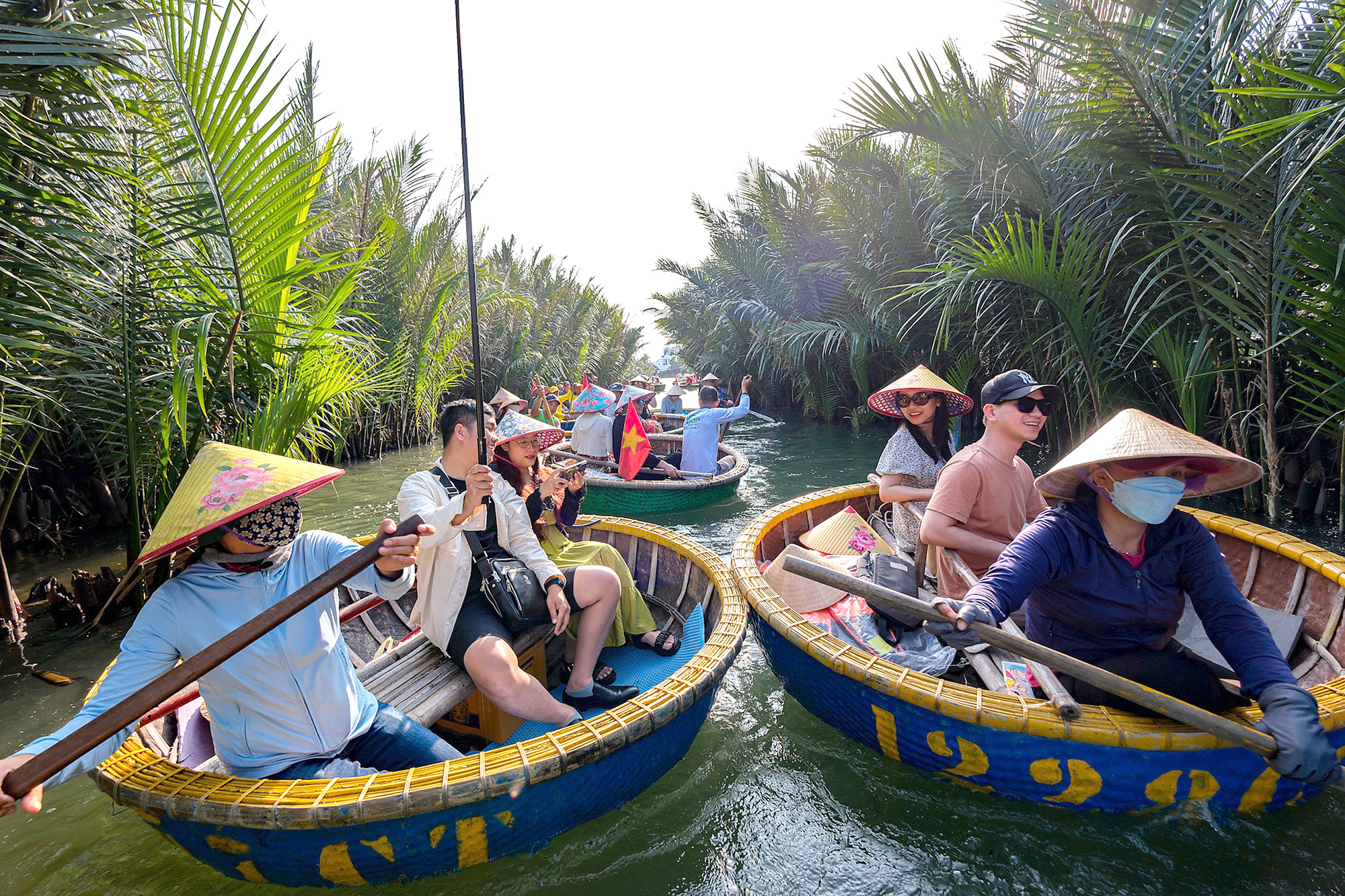 Tourists take a boat tour while visiting Hoi An City, central Vietnam. Photo: Nam Tran / Tuoi Tre