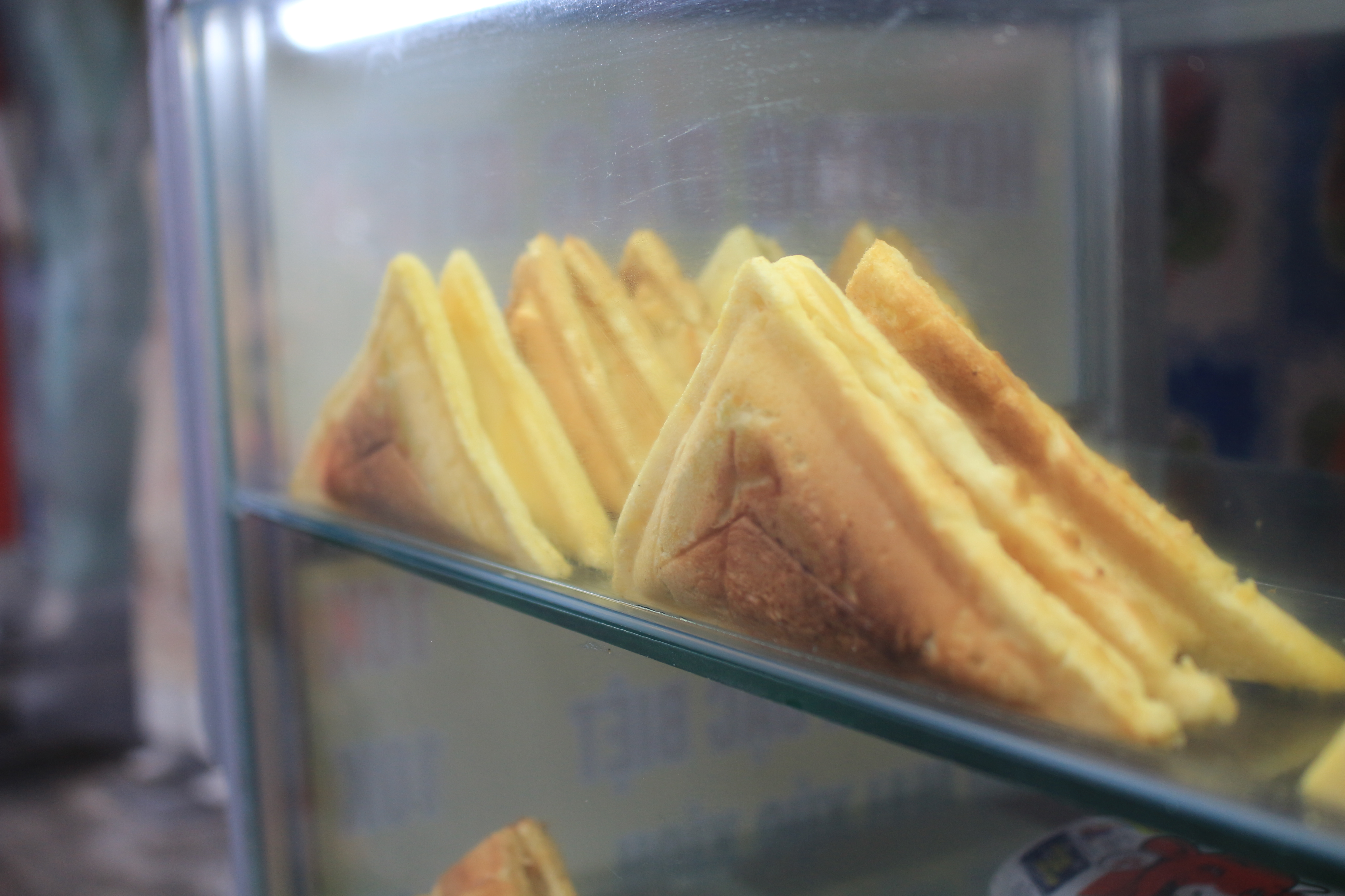 Vietnamese hot dogs are stored in a glass cabinet at a street stall in Go Vap District, Ho Chi Minh City. Photo: Ray Kuschert / Tuoi Tre News