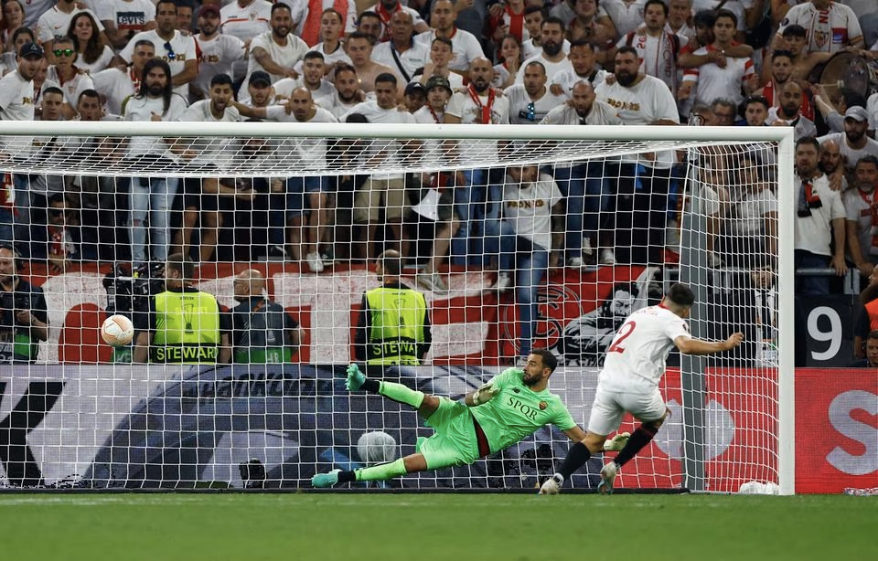 Soccer Football - Europa League - Final - Sevilla v AS Roma - Puskas Arena, Budapest, Hungary - June 1, 2023 Sevilla's Gonzalo Montiel scores a penalty during the shoot-out to win the Europa League. Photo: Reuters