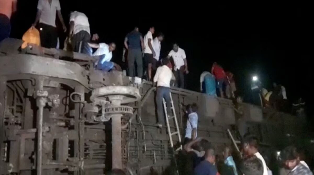 People try to escape from toppled compartments, following the deadly collision of two trains, in Balasore, India June 2, 2023, in this screen grab obtained from a video. Photo: Reuters
