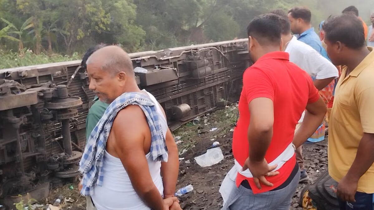 People stand next to a damaged coach, after trains collided in Balasore, India June 3, 2023, in this screen grab obtained from a social media video. Photo: Reuters