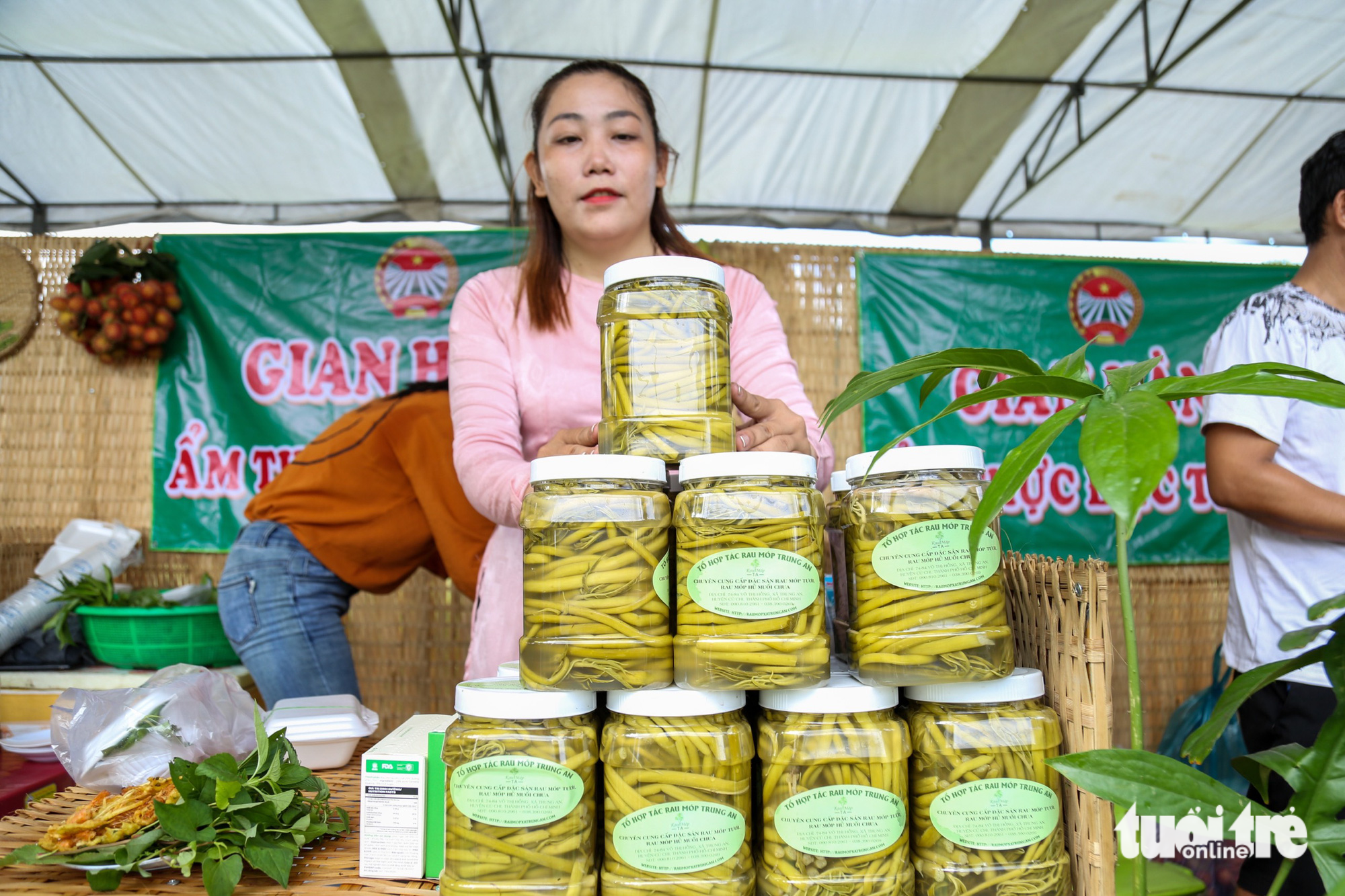 Bottles of a vegetable pickle product are displayed during a program offering countryside experiences in Trung An Commune, Cu Chi District, Ho Chi Minh City, June 3, 2023. Photo: Tuoi Tre