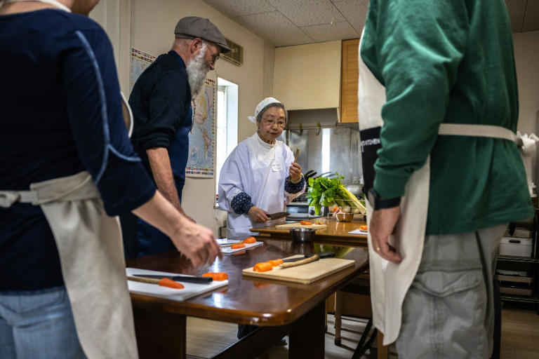 'Shojin ryori' specialist Mari Fujii (C) leads workshops on how to cook traditional Buddhist vegetarian cuisine