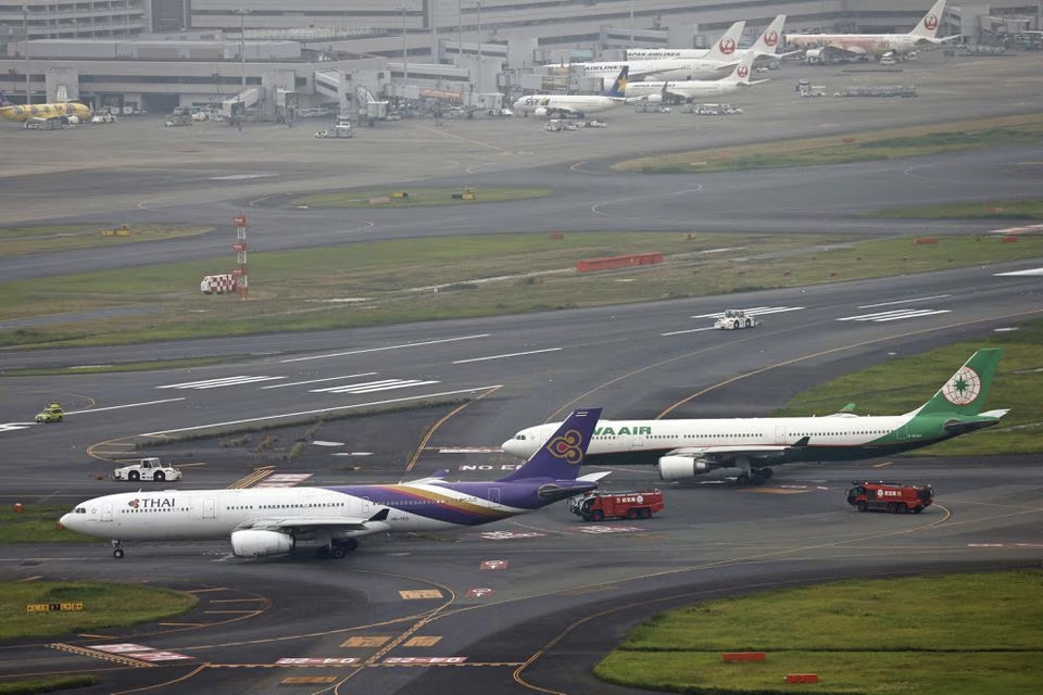 An aerial view shows Thai Airways and Eva Air aeroplanes on a taxiway after making contact at Haneda Airport, in Tokyo, Japan, June 10, 2023, in this photo released by Kyodo. Mandatory credit Kyodo via Reuters