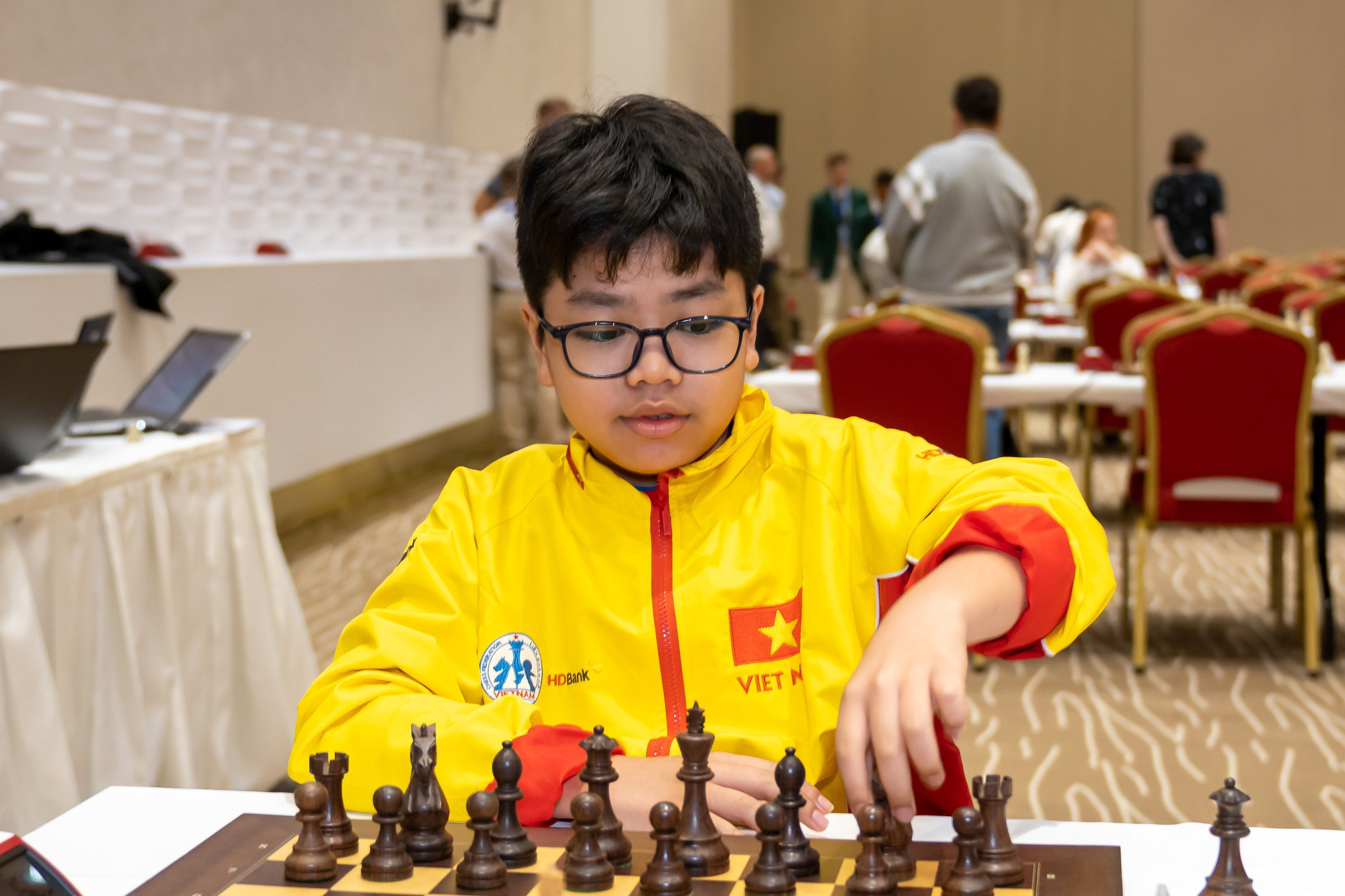 Young Vietnamese chess player Dau Khuong Duy wins gold medal in the Boys U12 event at the World Youth Rapid and Blitz Chess Championship 2023. Photo: Lam Minh Chau
