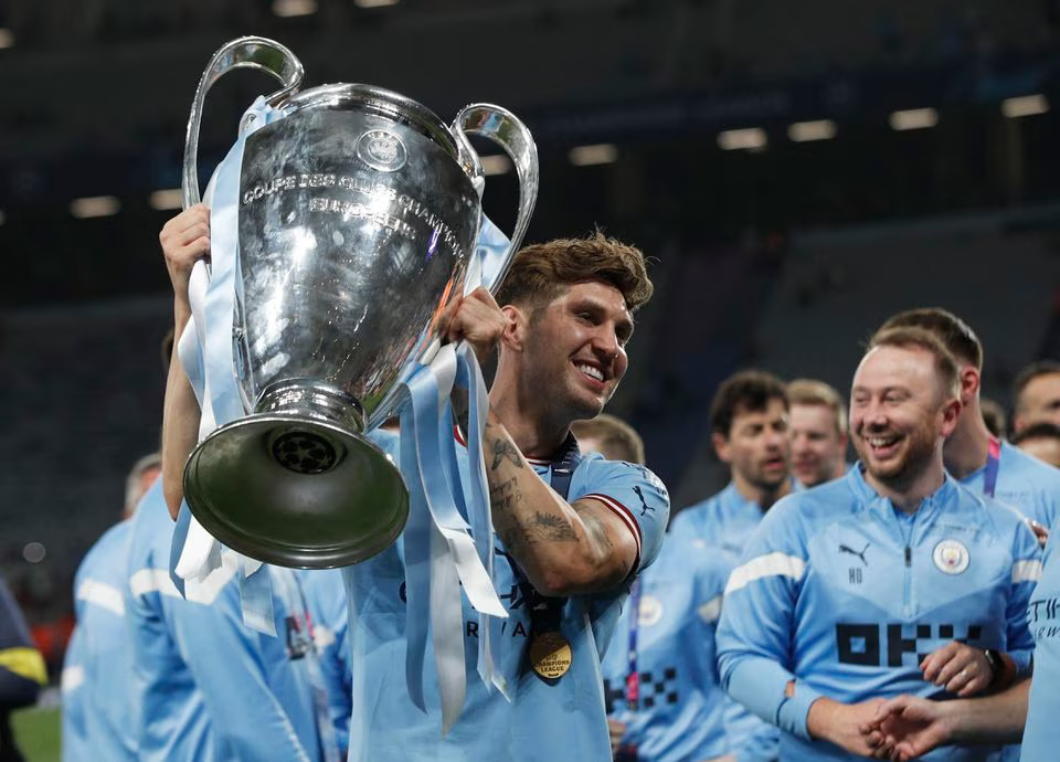 Soccer Football - Champions League Final - Manchester City v Inter Milan - Ataturk Olympic Stadium, Istanbul, Turkey - June 11, 2023 Manchester City's John Stones celebrates with the trophy after winning the Champions League. Photo: Reuters