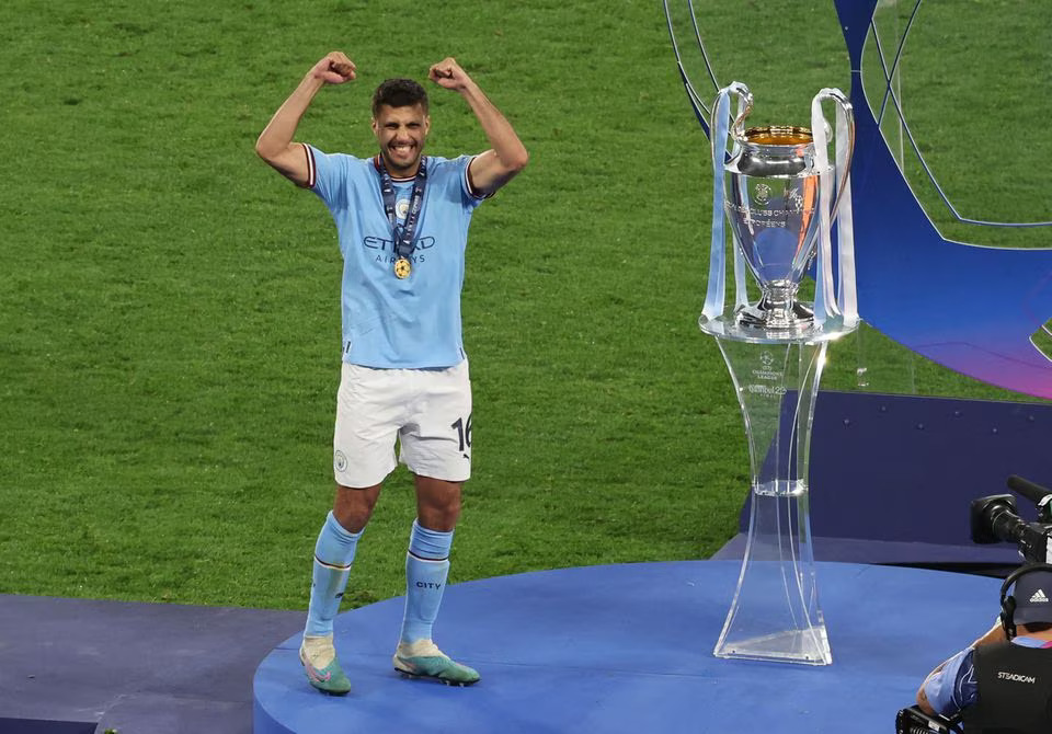 Soccer Football - Champions League Final - Manchester City v Inter Milan - Ataturk Olympic Stadium, Istanbul, Turkey - June 11, 2023 Manchester City's Rodri celebrates next to the Champions League trophy before the presentation. Photo: Reuters