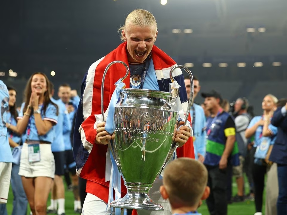 Soccer Football - Champions League Final - Manchester City v Inter Milan - Ataturk Olympic Stadium, Istanbul, Turkey - June 11, 2023 Manchester City's Erling Braut Haaland celebrates with the trophy after winning the Champions League. Photo: Reuters
