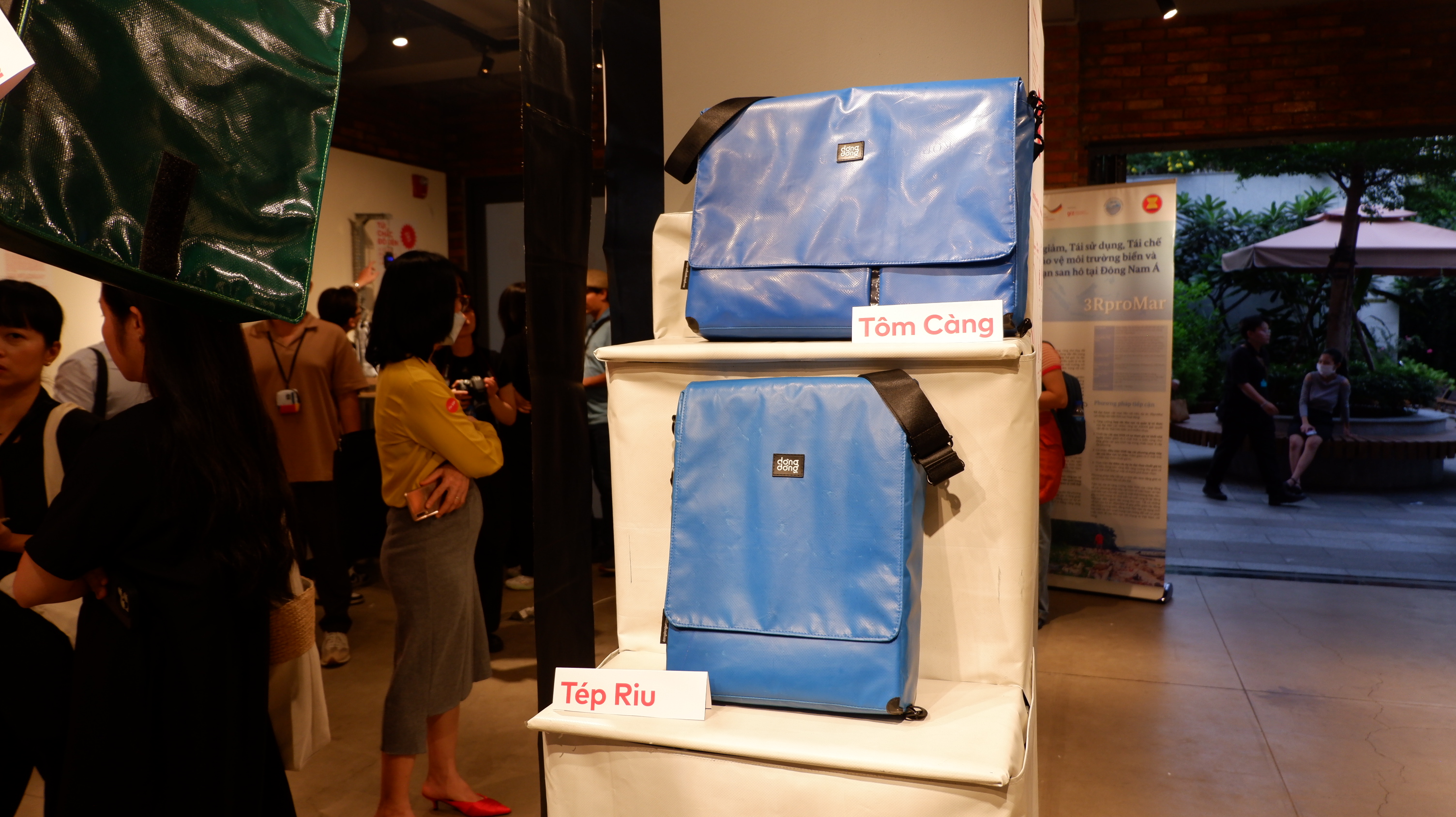 Bags made of shrimp pond lining tarp are displayed at a launch event hosted by Dong Dong in Ho Chi Minh City on June 15, 2023. Photo: Dong Nguyen / Tuoi Tre News