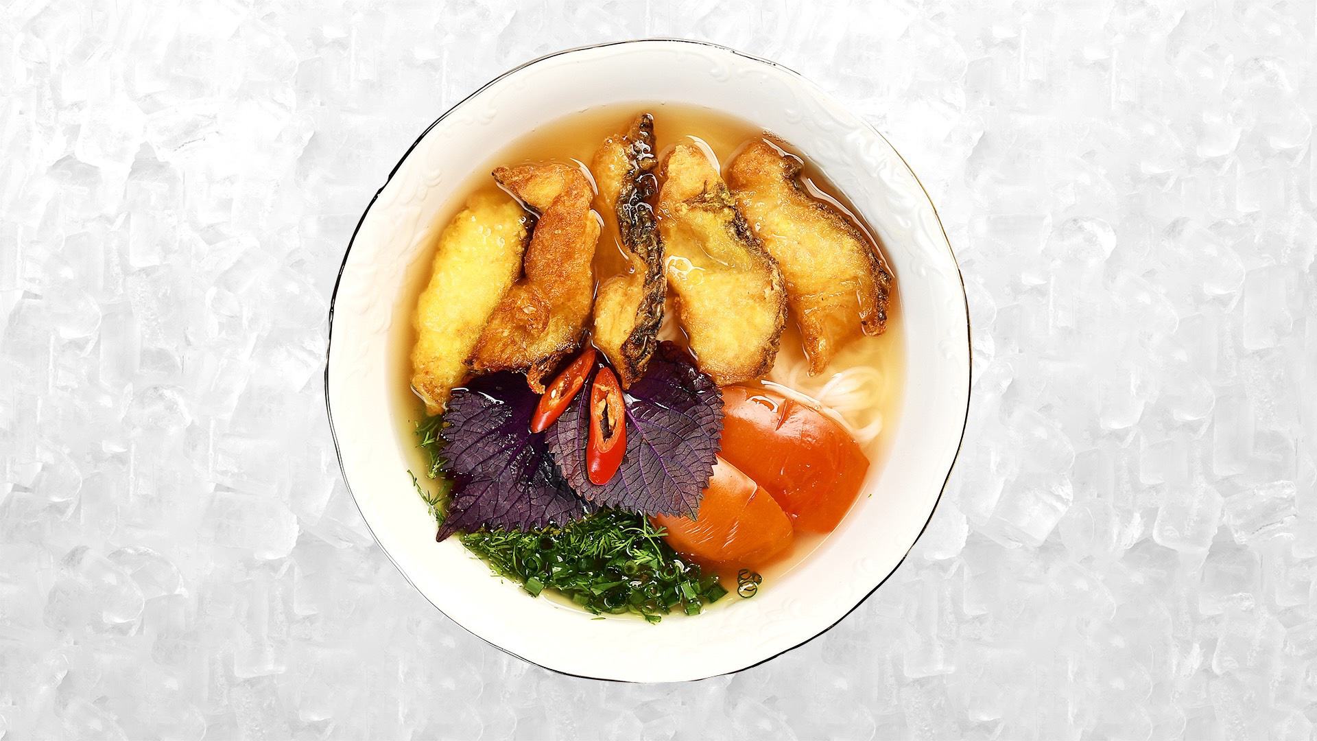 A supplied photo shows a bowl of 'bún cá' (fish vermicelli soup) produced by PQ Foods.