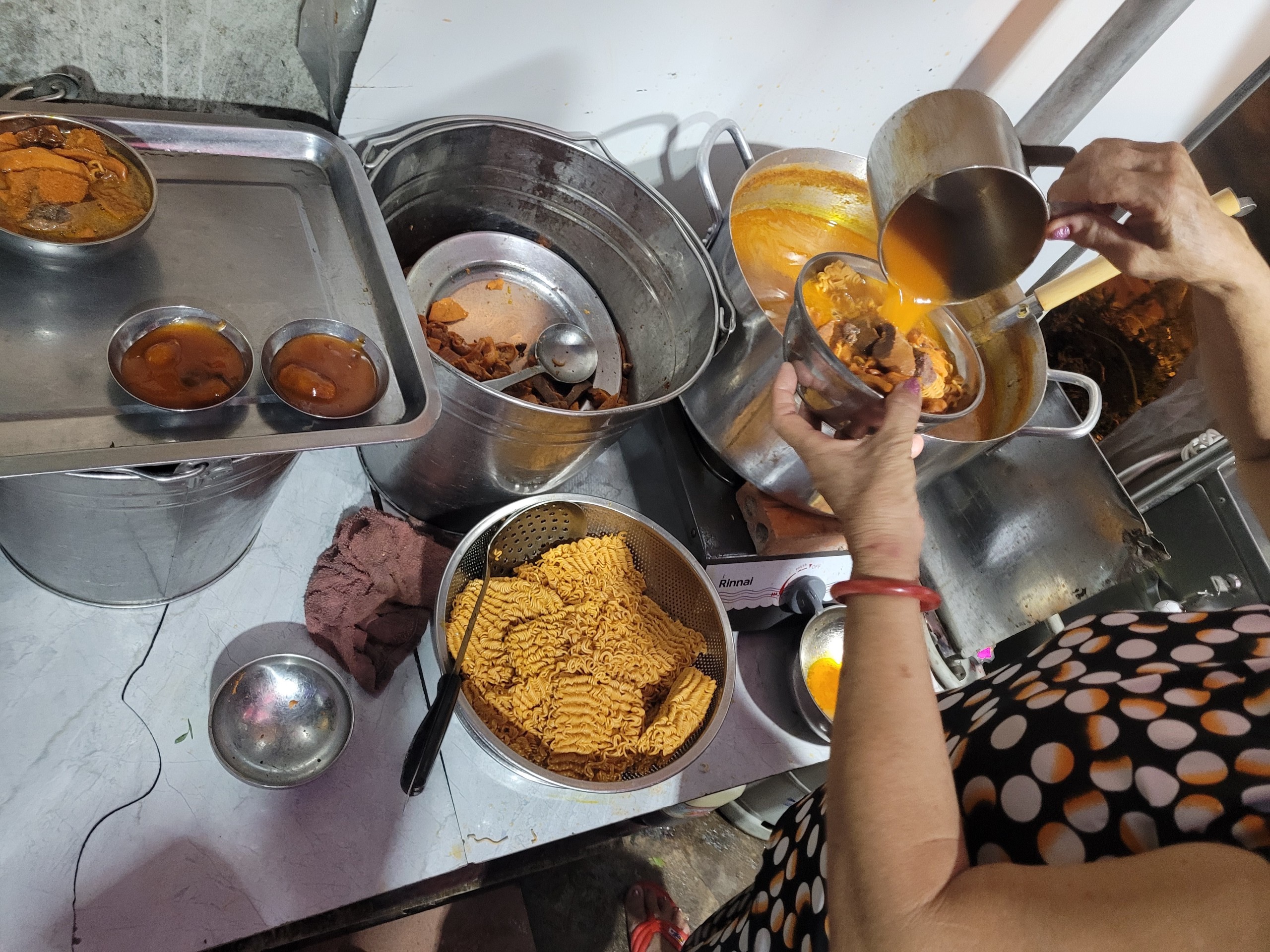 A women serves 'phá lấu' at a shop in Binh Thanh District, Ho Chi Minh City. Photo: Ray Kuschert / Tuoi Tre News