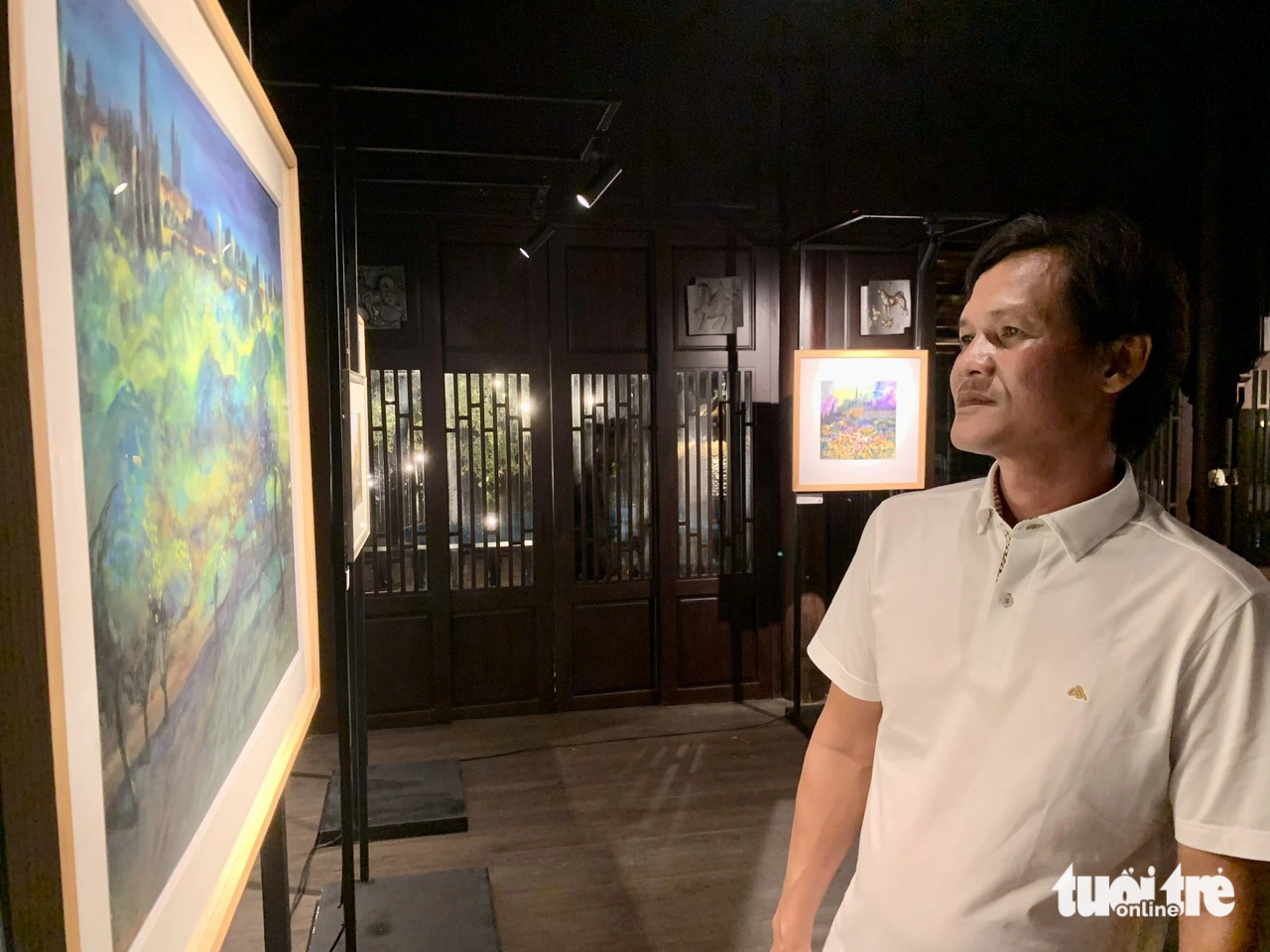 Artist Duong Thuy is pictured at the exhibition ‘Italy: From Plein Air to Atelier' held in Thu Duc City, Ho Chi Minh City, June 30, 2023. Photo: Hoai Phuong / Tuoi Tre