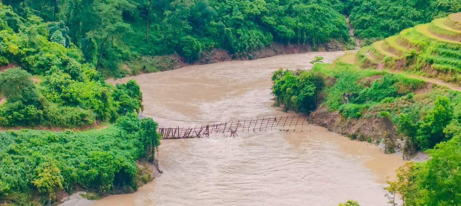 A suspension bridge over the Chay River in Pho Ly Ngai Commune in Hoang Su Phi District is damaged by heavy rains. Photo: Supplied