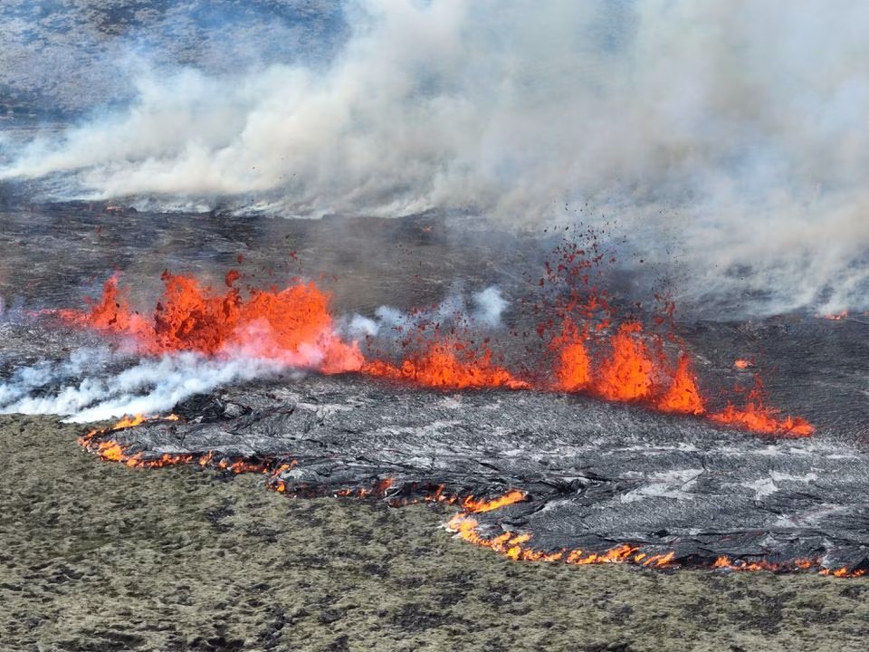 Smoke billows and lava spurts after the eruption of a volcano, on the Reykjanes peninsula, near the capital Reykjavik, in southwest Iceland, July 10, 2023, in this picture obtained from social media. Photo: Reuters