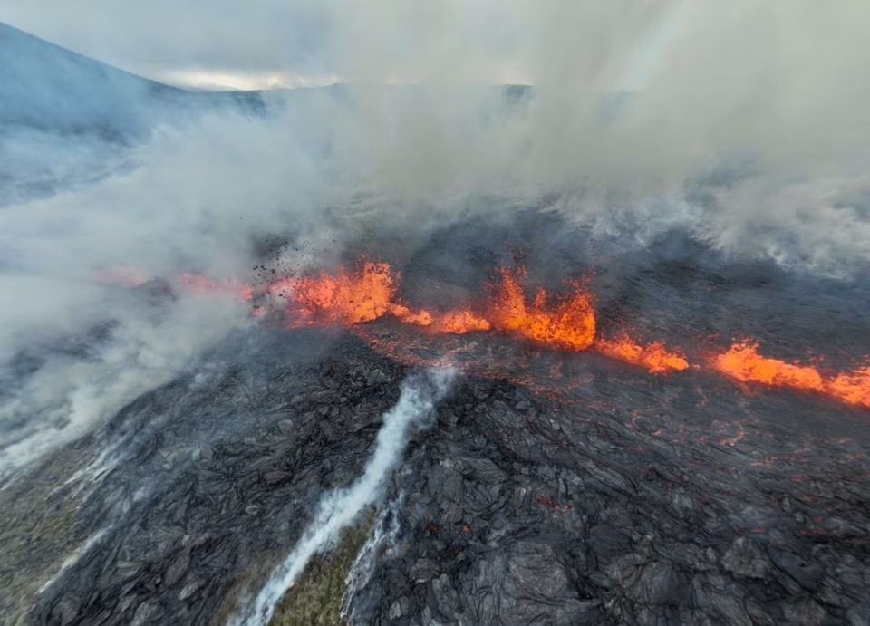 Smoke billows and lava spurts after the eruption of a volcano, on the Reykjanes peninsula, near the capital Reykjavik, in southwest Iceland, July 10, 2023, in this picture obtained from social media. Photo: Reuters