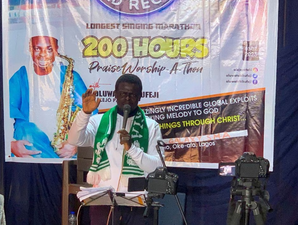 Nigerian gospel singer Oluwatobi Kufeji, 39, sings as he attempts to break a Guinness world record of longest singing hours, in Lagos, Nigeria July 9, 2023. Photo: Reuters