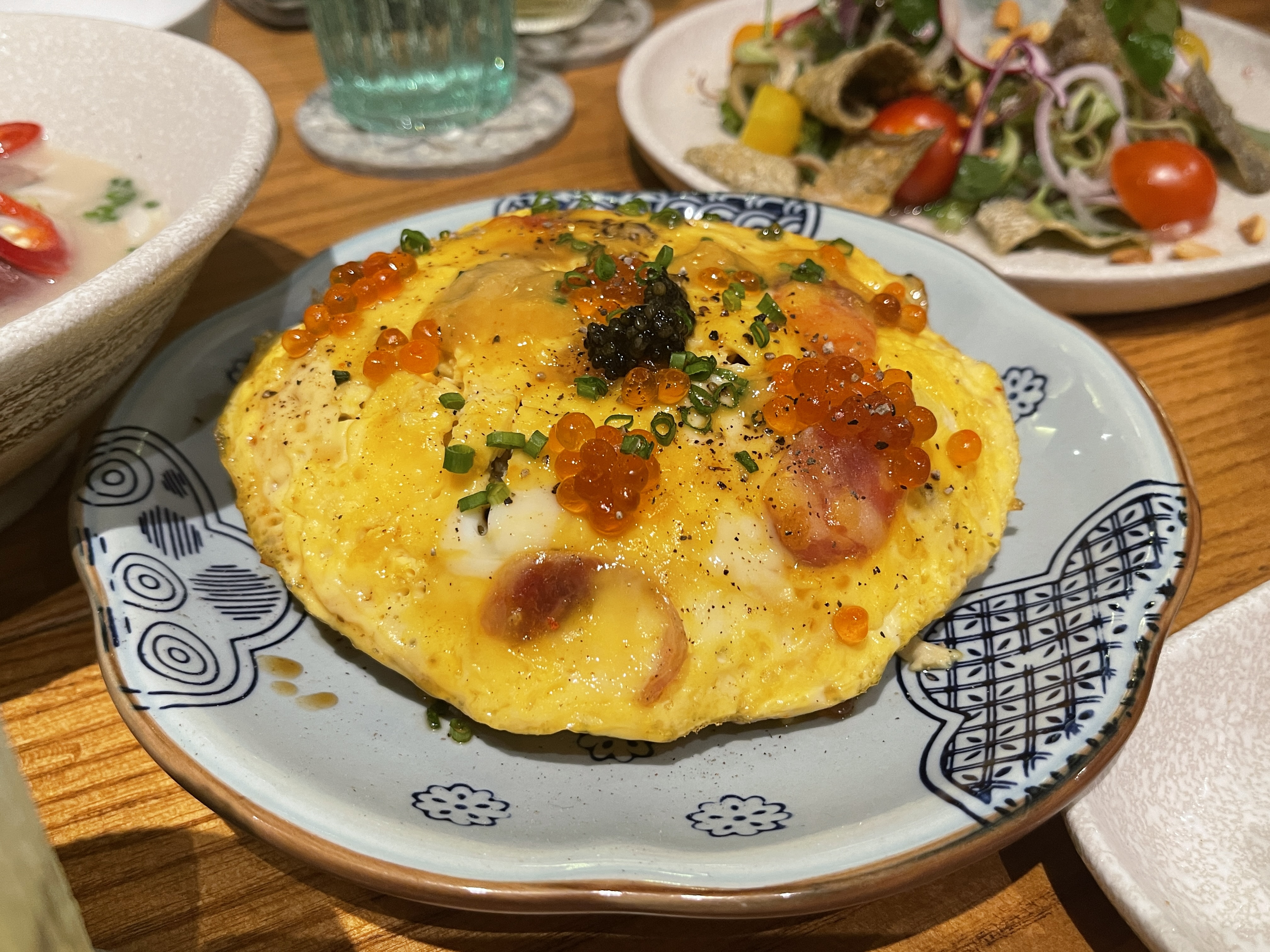 Lap cheong (Chinese sausage) fried rice topped with caviars from Vietnam's Central Highlands City of Da Lat and sea urchin from Phu Quoc Island off southern Vietnam. Photo: Dong Nguyen / Tuoi Tre News