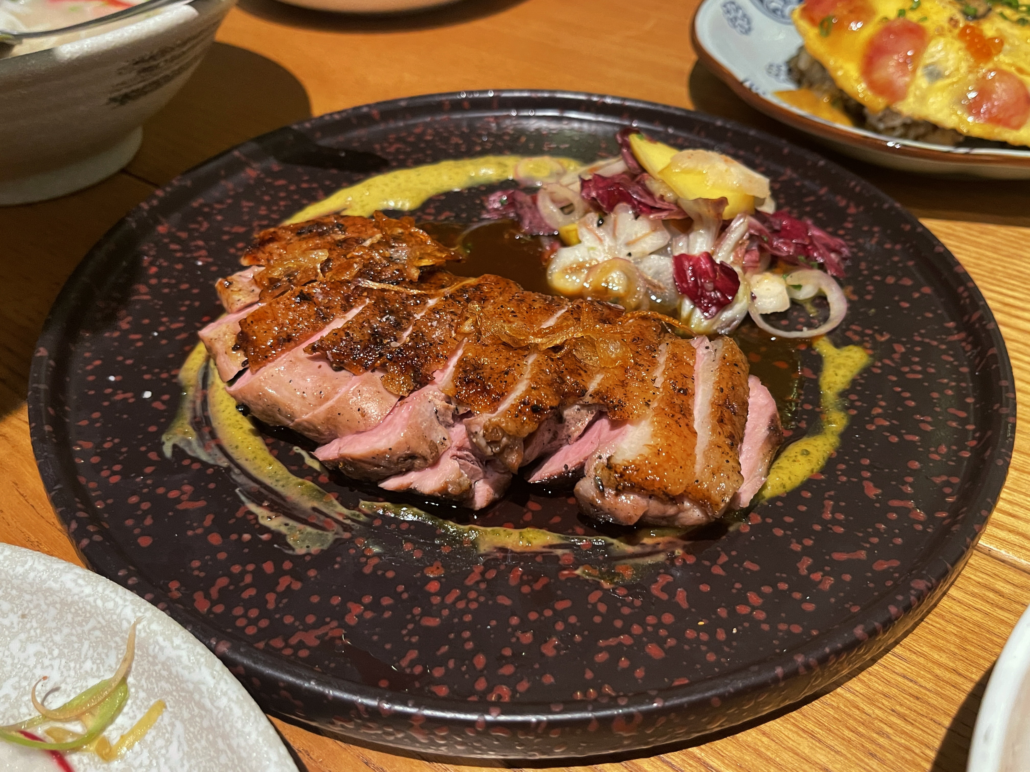 Grilled aged duck breast with summer fruits and fermented tofu sauce. Photo: Dong Nguyen / Tuoi Tre News