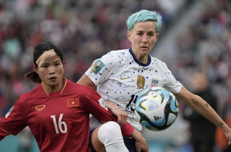 Jul 22, 2023; Auckland, NZL; USA forward Megan Rapinoe (15) battles for the ball against Vietnam midfielder Duong Thi Van (16) in the second half of a group stage match in the 2023 FIFA Women's World Cup at Eden Park. Mandatory Credit: Jenna Watson-USA TODAY Sports