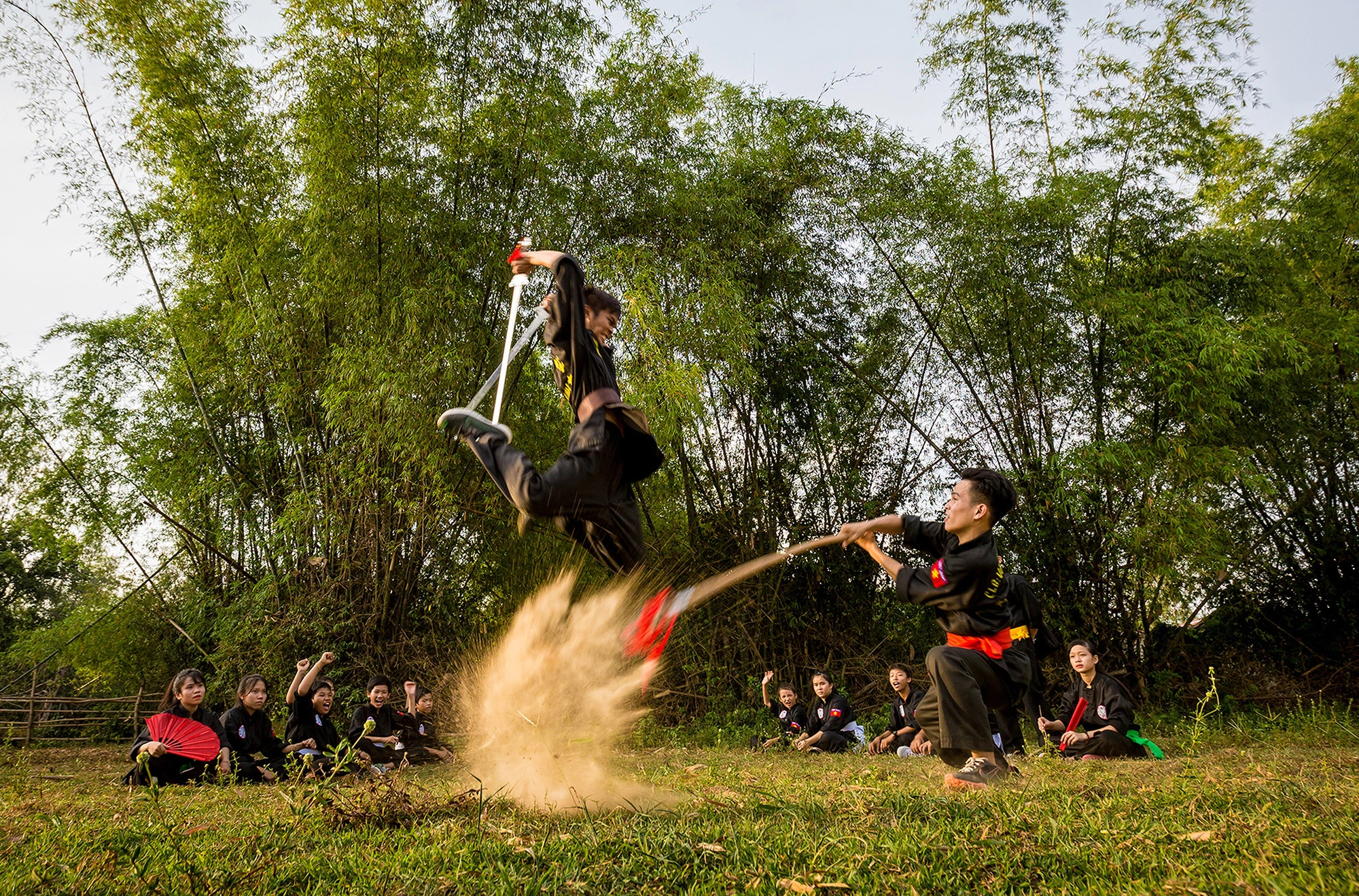 Two practitioners of traditional martial arts are in action. Photo: Phan Minh Tho