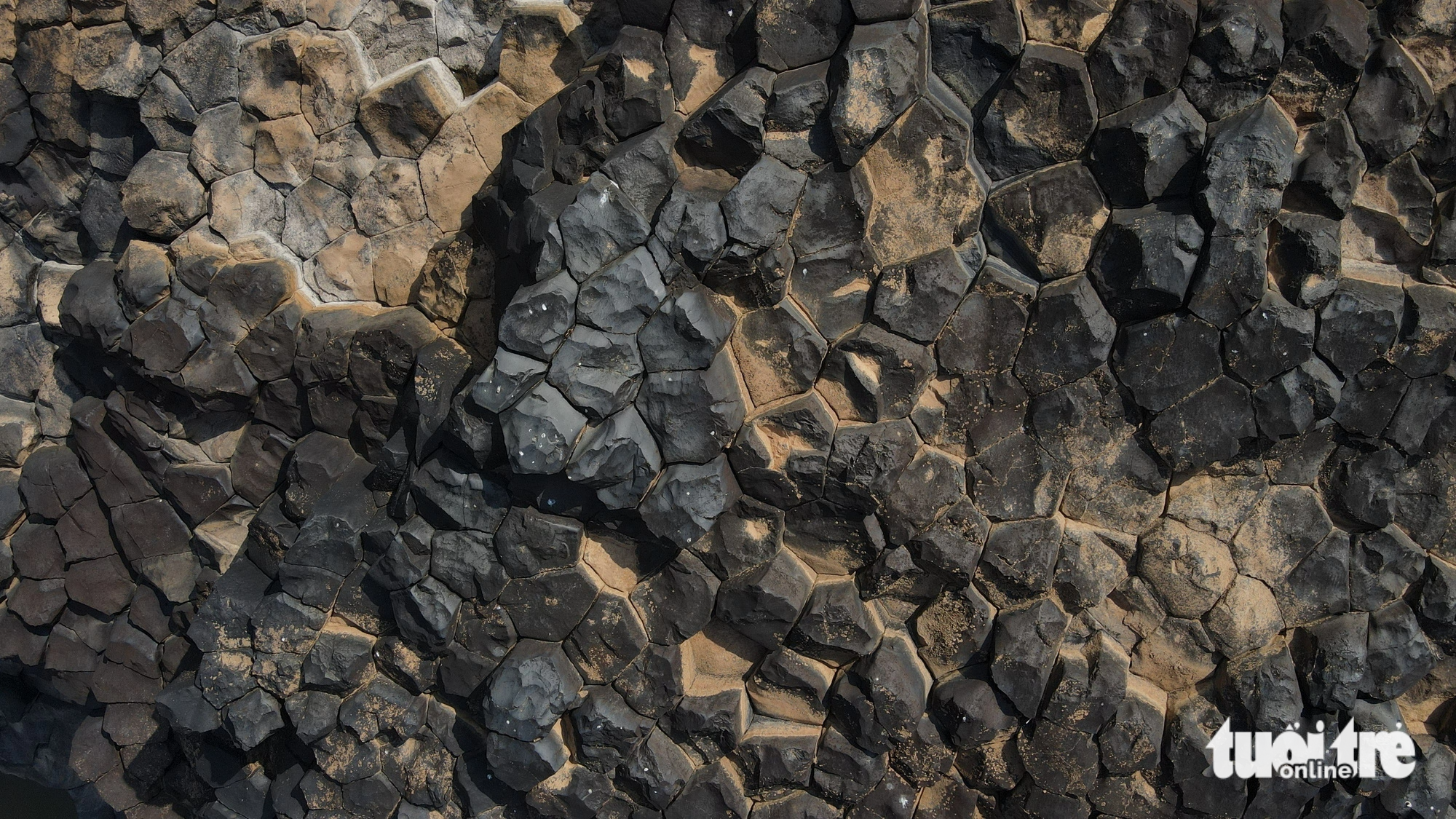 The ancient rock field includes stone columns with a hexagonal shape standing close to each other, which look like a giant beehive.