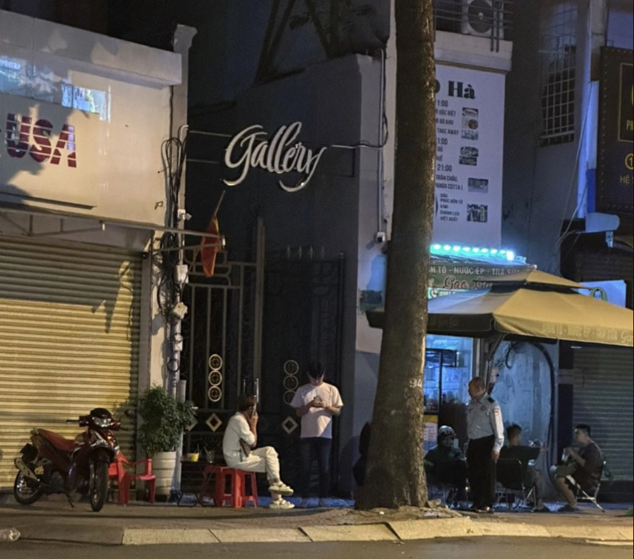 Security guards work in front of the entrance gate of the restaurant to signal to people inside the facility. Photo: Supplied