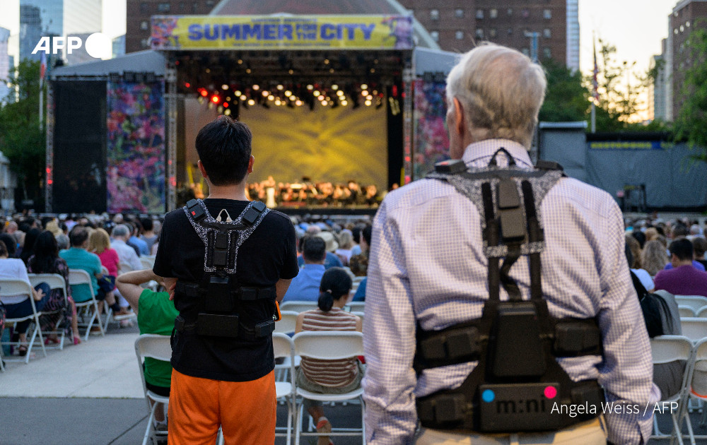 Concertgoers wear haptic suits created for the deaf by Music: Not Impossible, during an outdoor concert at Lincoln Center on July 22, 2023, in New York City. Photo: AFP