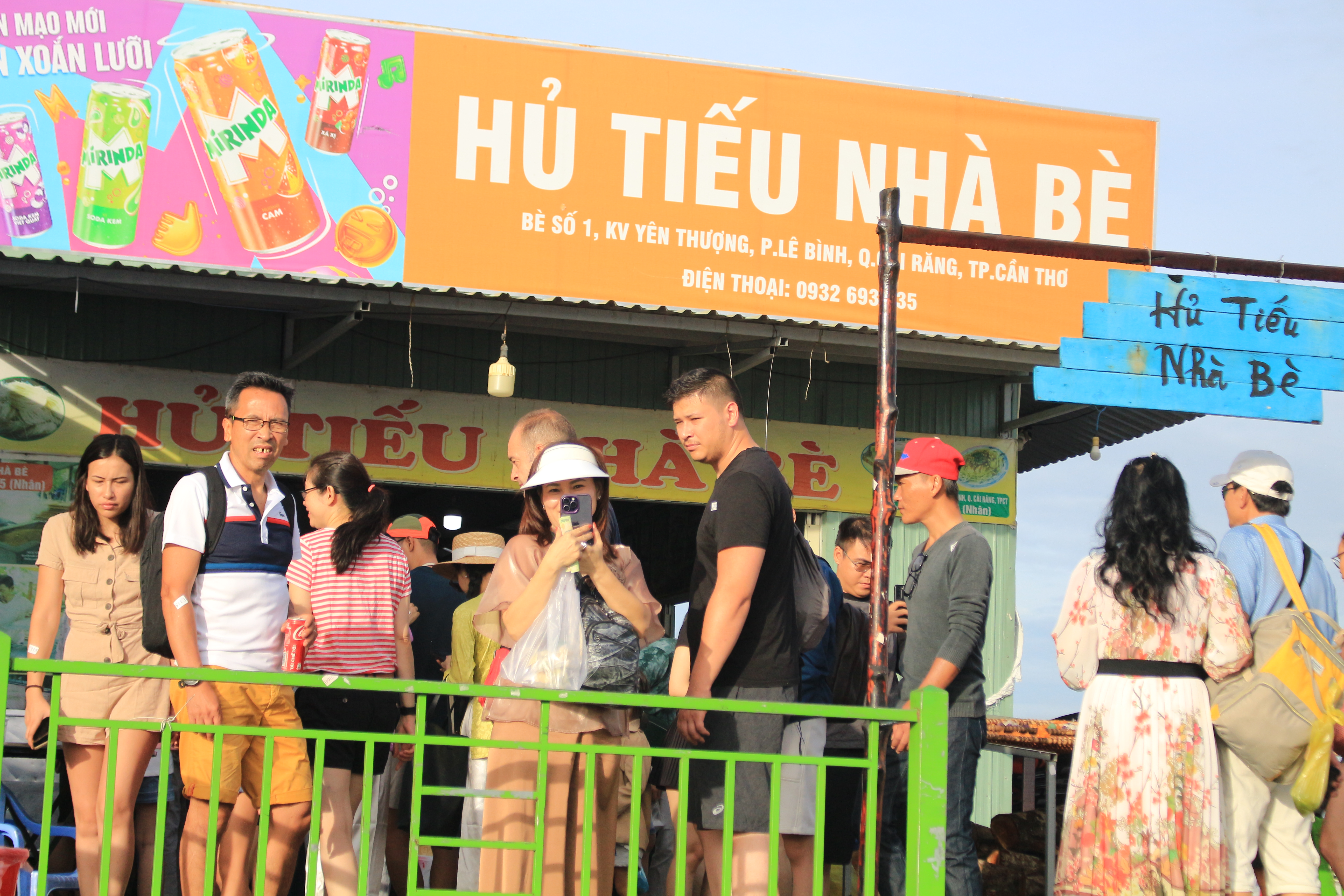 Tourists visit a shop which is around 10 meters off the riverbank and sells dry fish and noodle while visiting the Cai Rang Floating Market in Can Tho City, southern Vietnam. Photo: Ray Kuschert / Tuoi Tre News