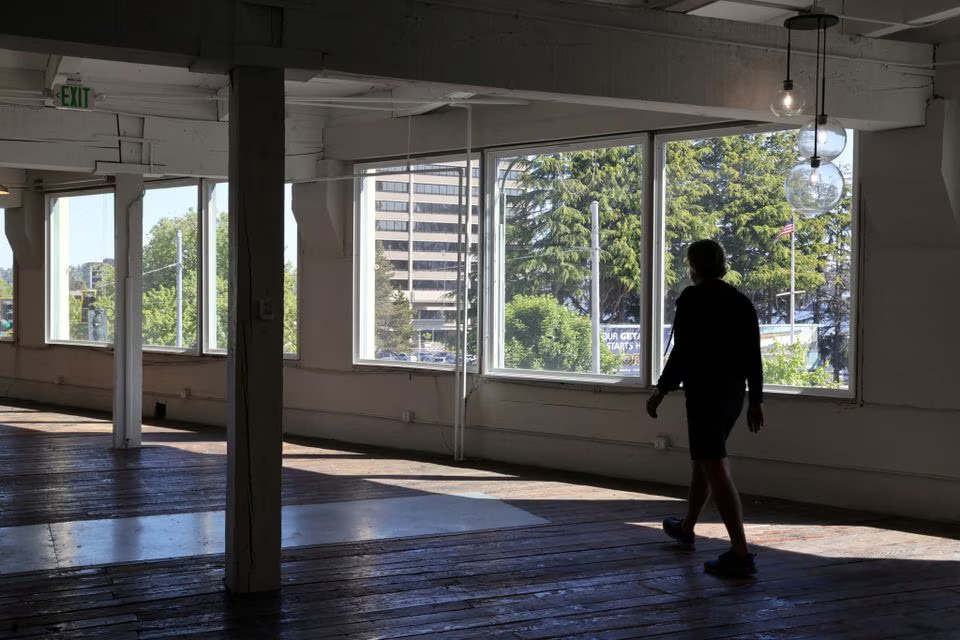Collin Madden, founding partner of GEM Real Estate Partners, walks through empty office space in a building they own that is up for sale in the South Lake Union neighborhood in Seattle, Washington, U.S. May 14, 2021. Photo: Reuters