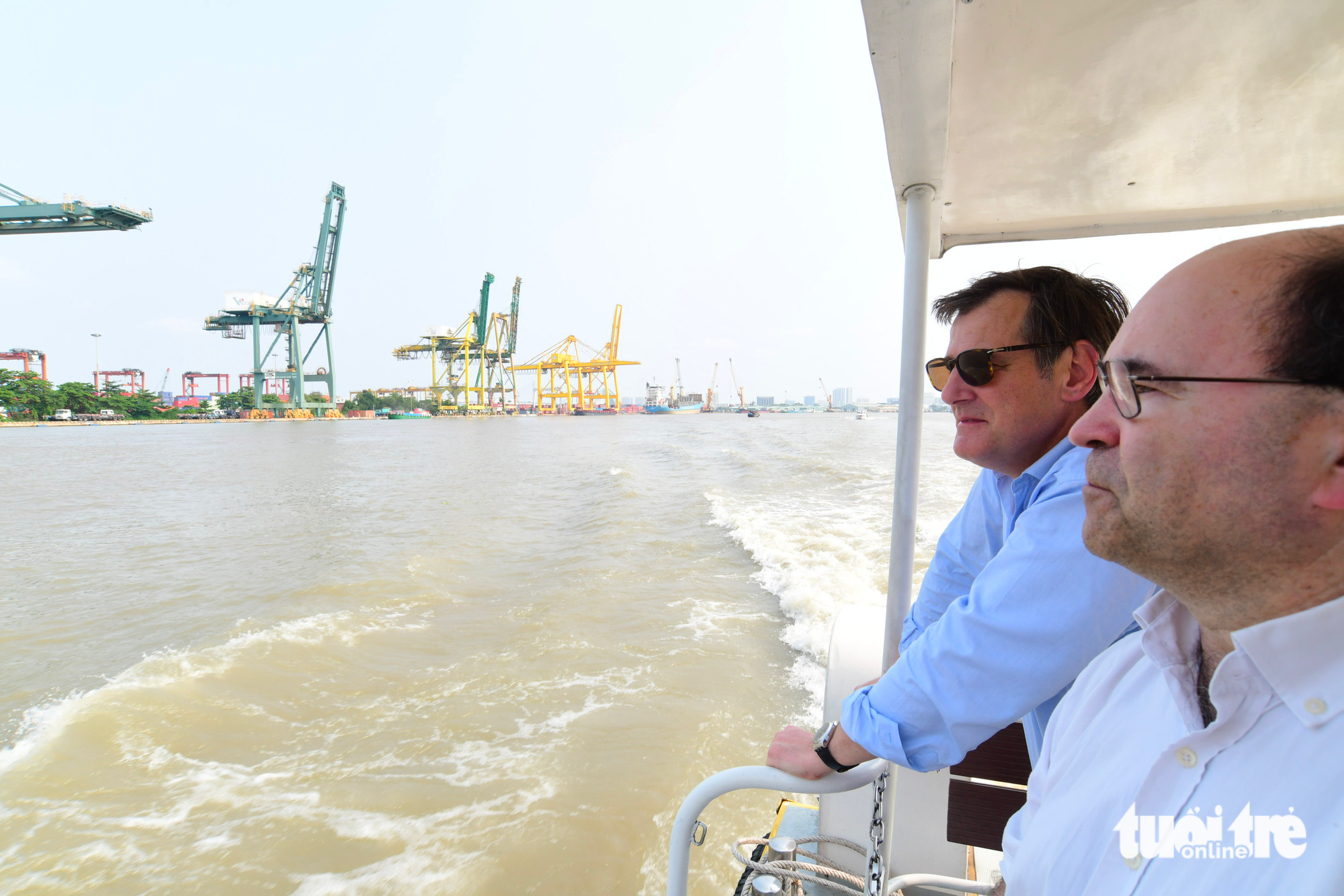 Spectators view landscapes along the Saigon River from a water bus. Photo: Quang Dinh / Tuoi Tre