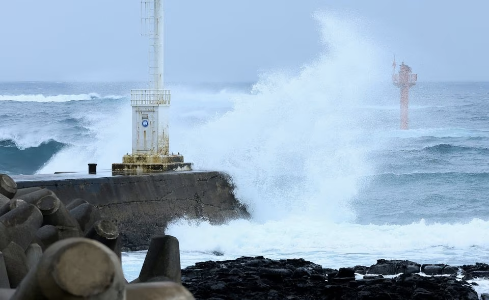 A high wave caused by typhoon Khanun hits a seawall in Seogwipo on Jeju island, South Korea, August 9, 2023. Yonhap via Reuters