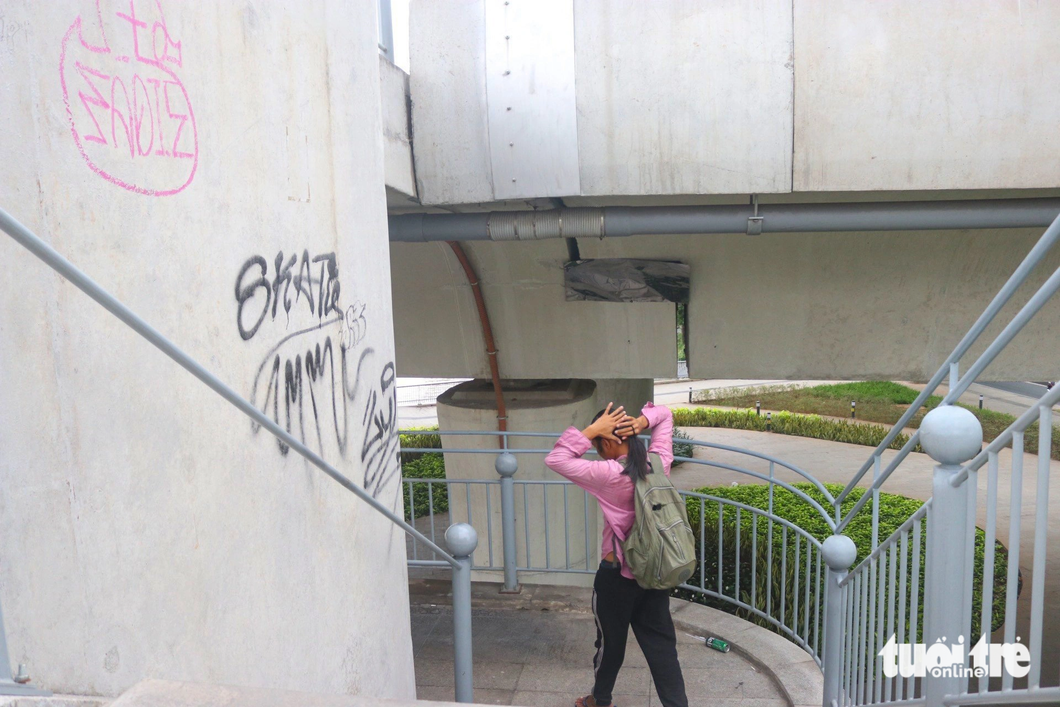 A pedestrian stairway of the Ba Son Bridge is covered with paint.