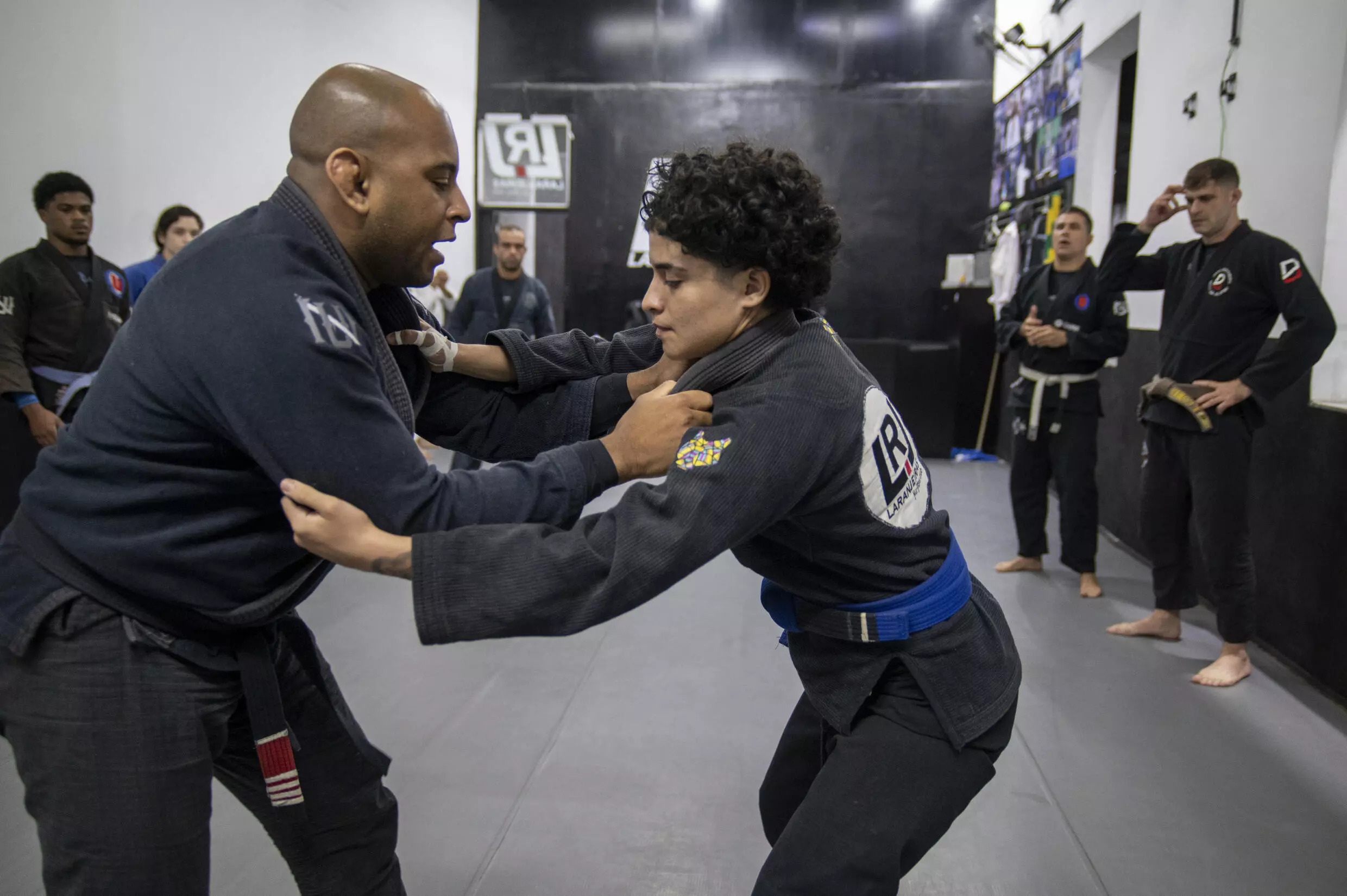 Jiujitsu instructor Cleber Ferreira (L) and athlete Beatriz Freitas train at Laranjeiras Jiu-Jitsu Club in Rio de Janeiro. Photo: AFP